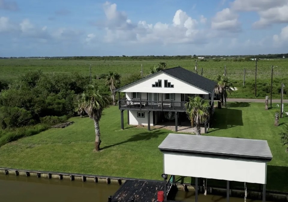 163 County Road 299 Sargent, TX 77414 - Photo 37 of 38 an aerial view of a house with a garden