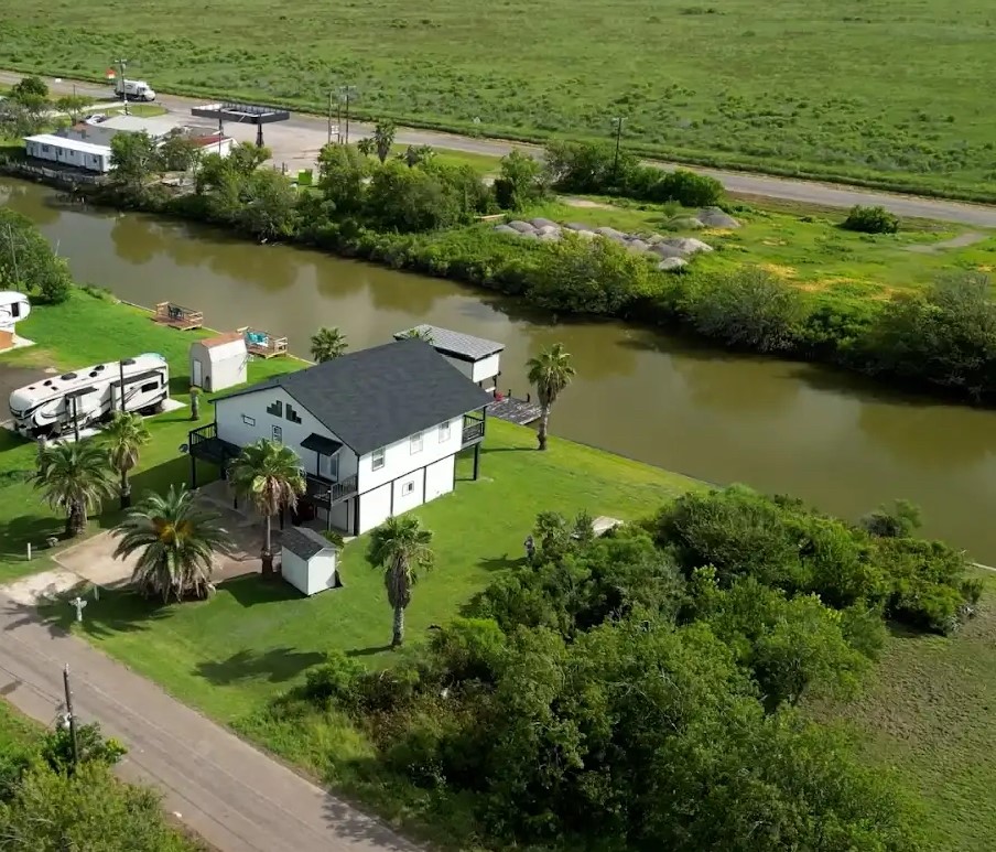 163 County Road 299 Sargent, TX 77414 - Photo 38 of 38 an aerial view of a house with a yard lake lake view and mountain view