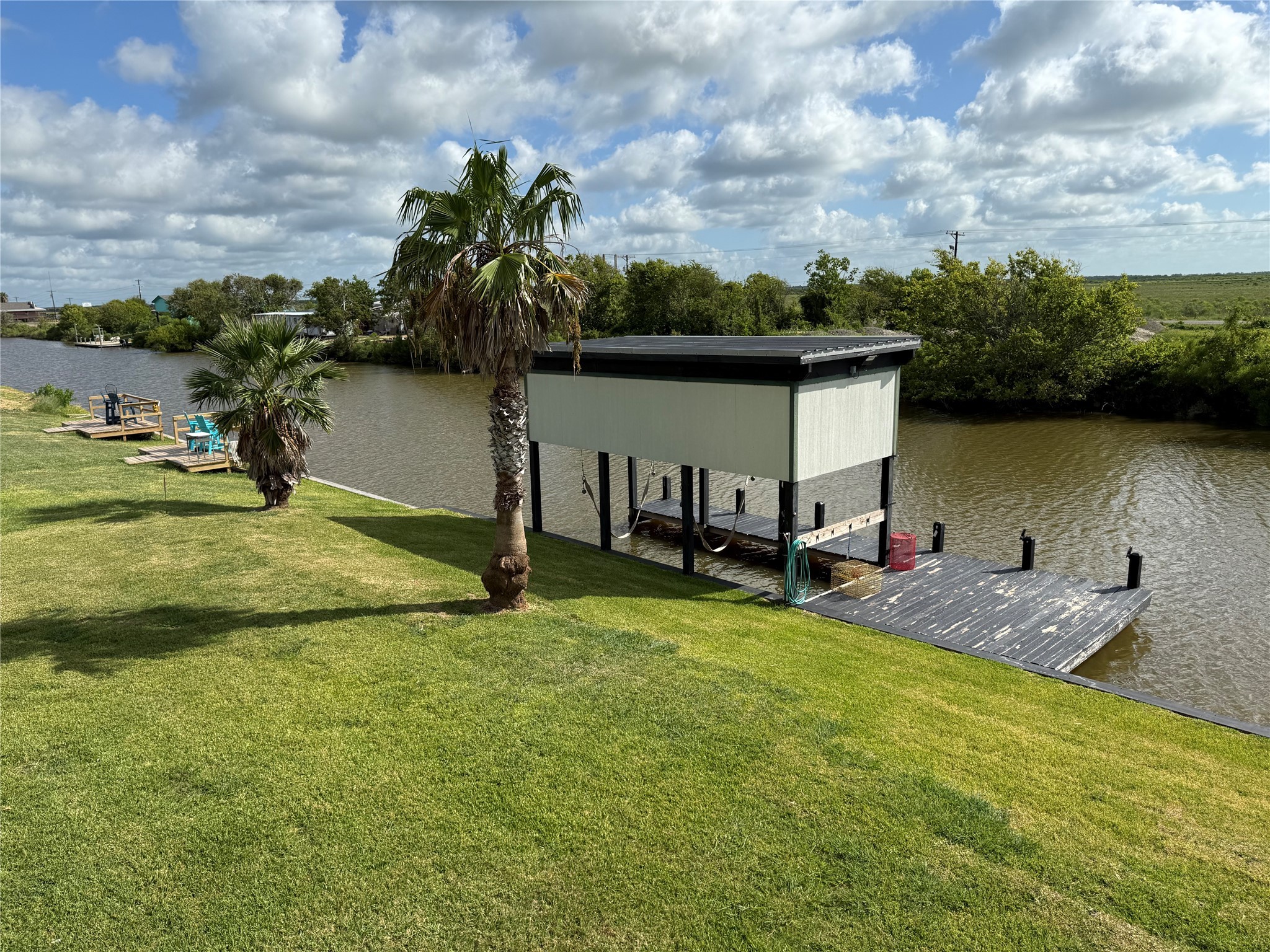 163 County Road 299 Sargent, TX 77414 - Photo 6 of 38 a view of a lake from a yard