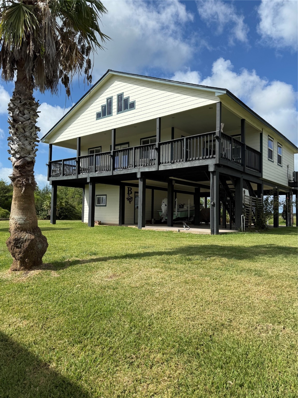 163 County Road 299 Sargent, TX 77414 - Photo 7 of 38 a front view of a house with a garden