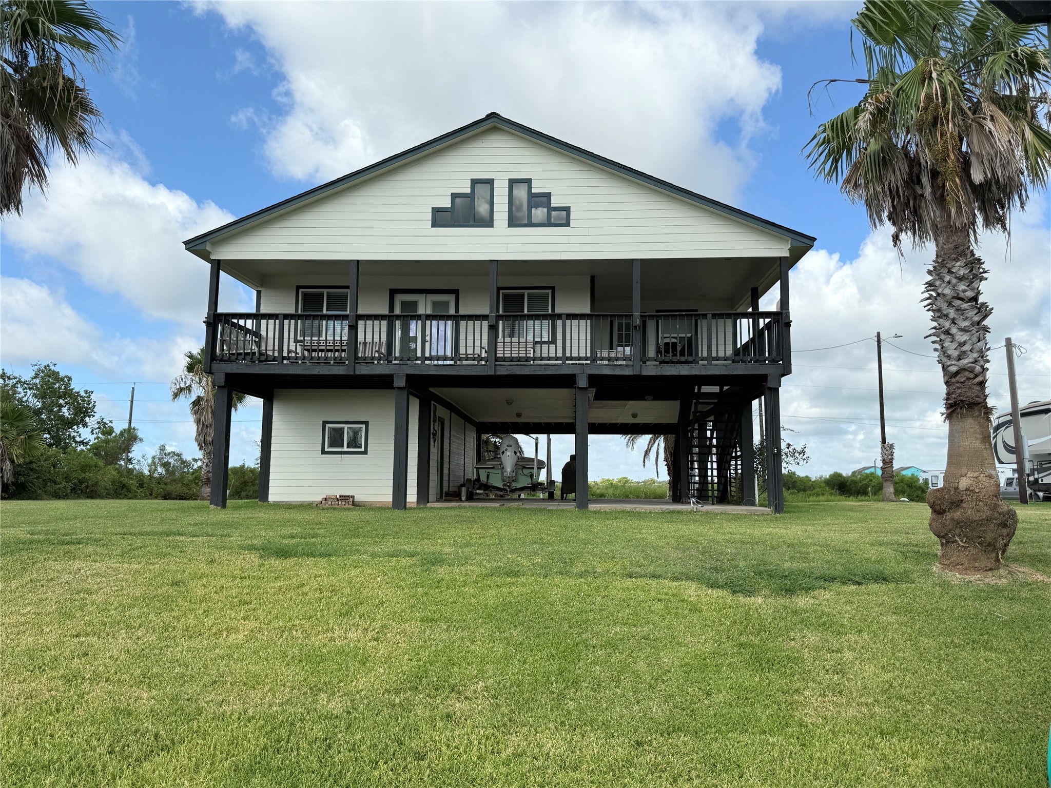 163 County Road 299 Sargent, TX 77414 - Photo 8 of 38 a front view of a house with garden