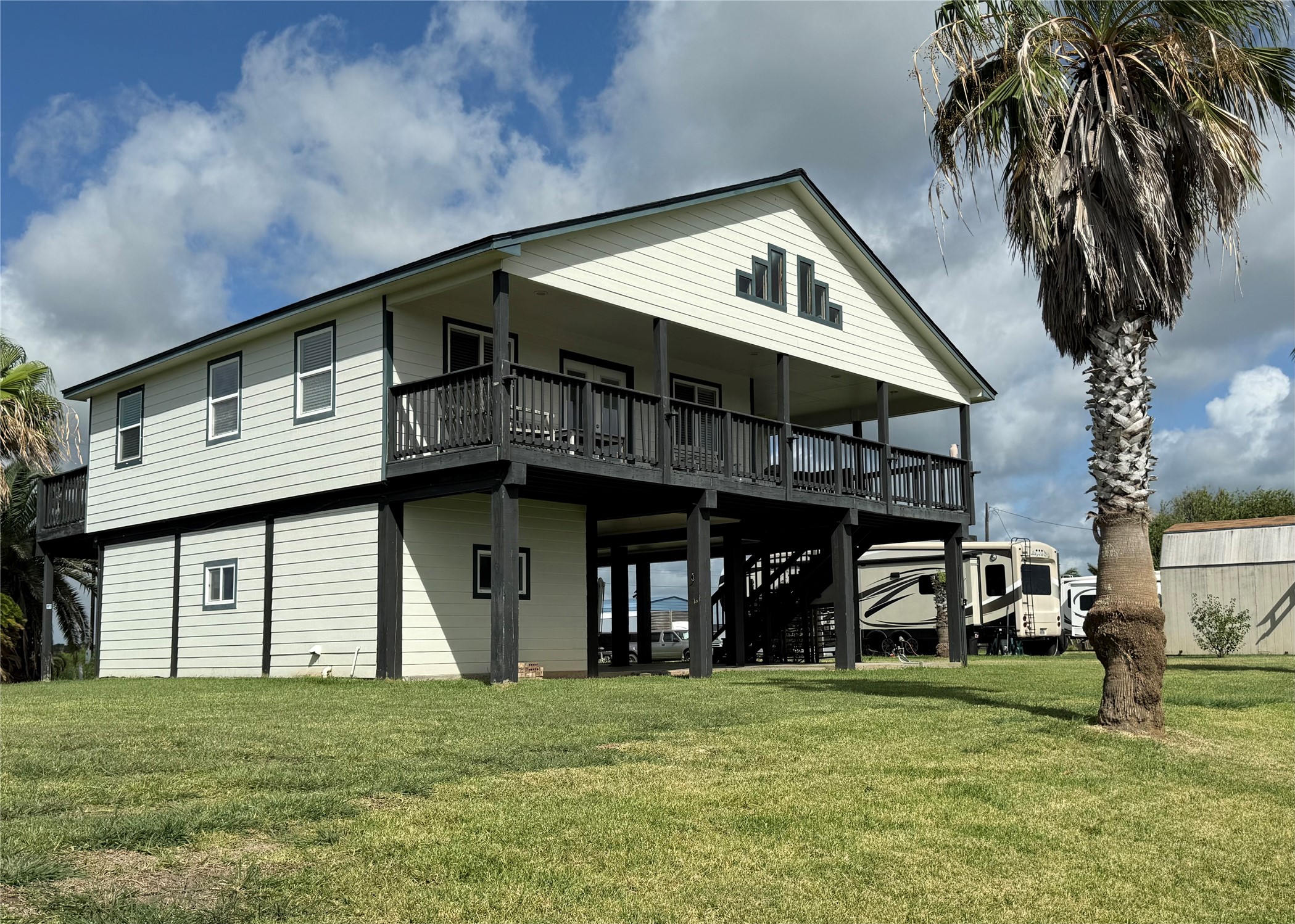 163 County Road 299 Sargent, TX 77414 - Photo 10 of 38 a front view of a house with garden