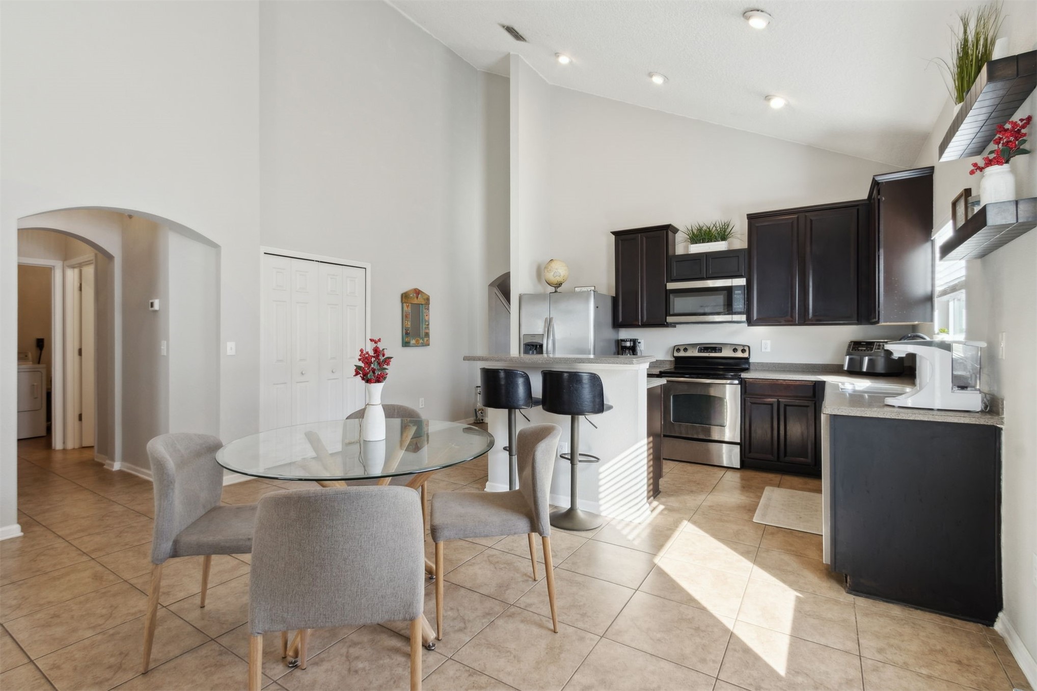 95029 Lavender Lane Fernandina Beach, FL 32034 - Photo 18 of 64 a kitchen with stainless steel appliances kitchen island granite countertop a refrigerator and a stove top oven