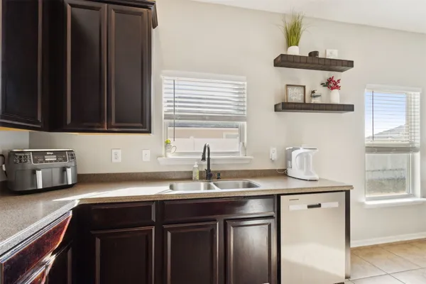 a bedroom with a bed and a television