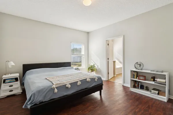 a bathroom with a sink a toilet a mirror and shower