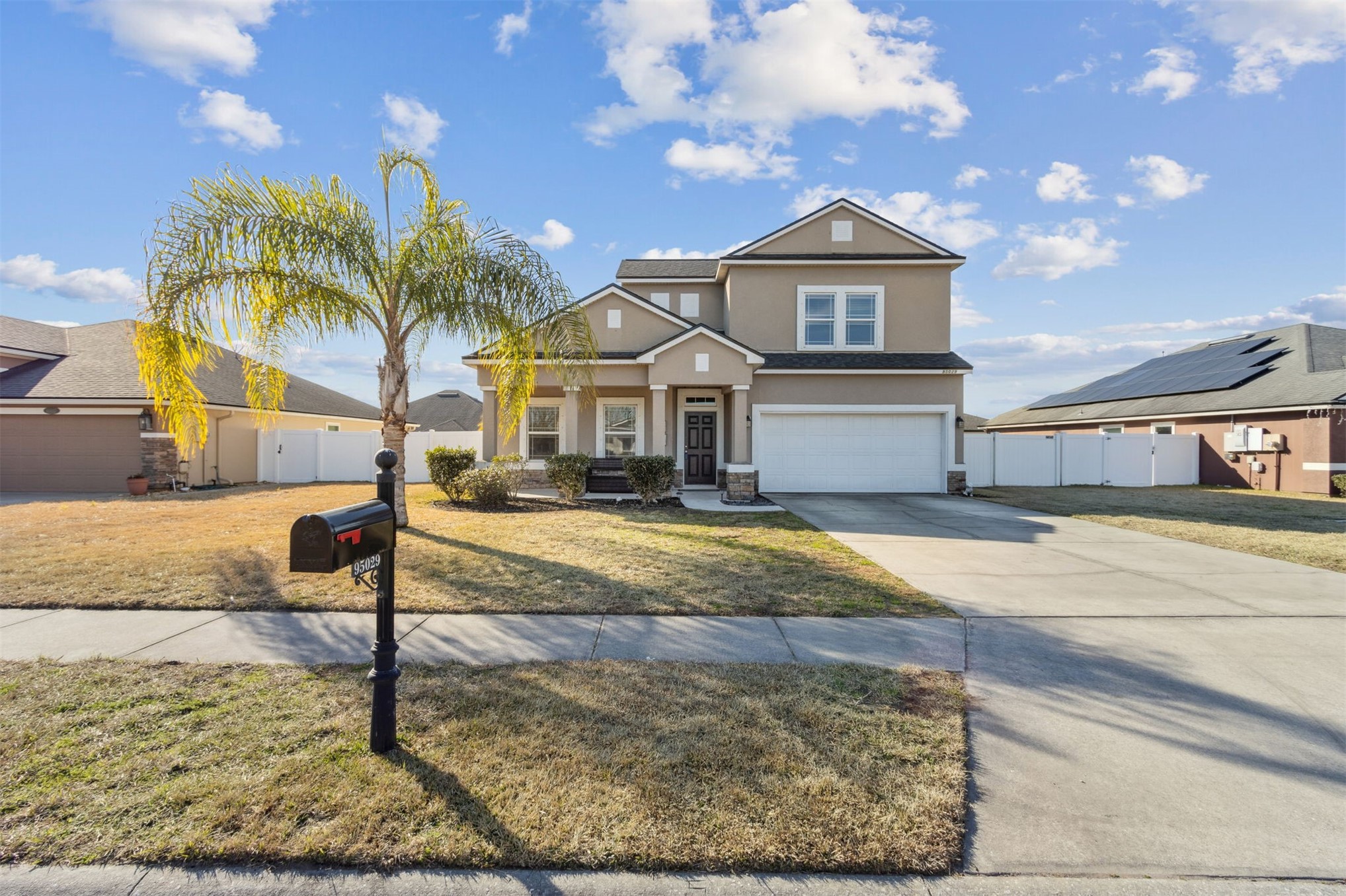 95029 Lavender Lane Fernandina Beach, FL 32034 - Photo 3 of 64 a front view of a house with a yard
