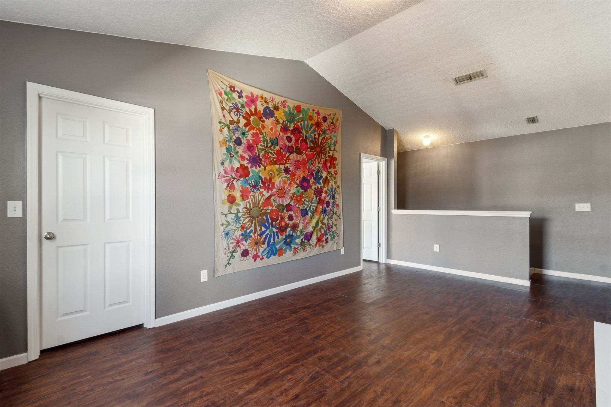 95029 Lavender Lane Fernandina Beach, FL 32034 - Photo 35 of 64 a view of an empty room with wooden floor and a painting on the wall