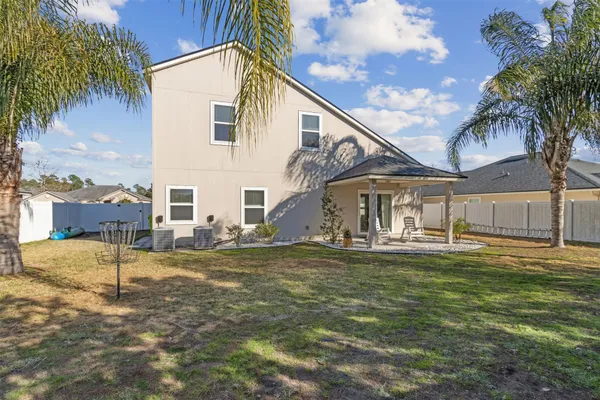 a view of an chairs and tables in the patio