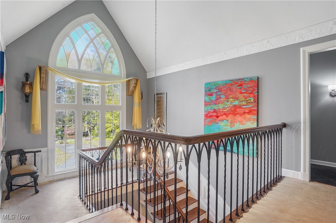 2070 Ridgewood Road Akron, OH 44313 - Photo 22 of 48 Staircase featuring high vaulted ceiling and a healthy amount of sunlight