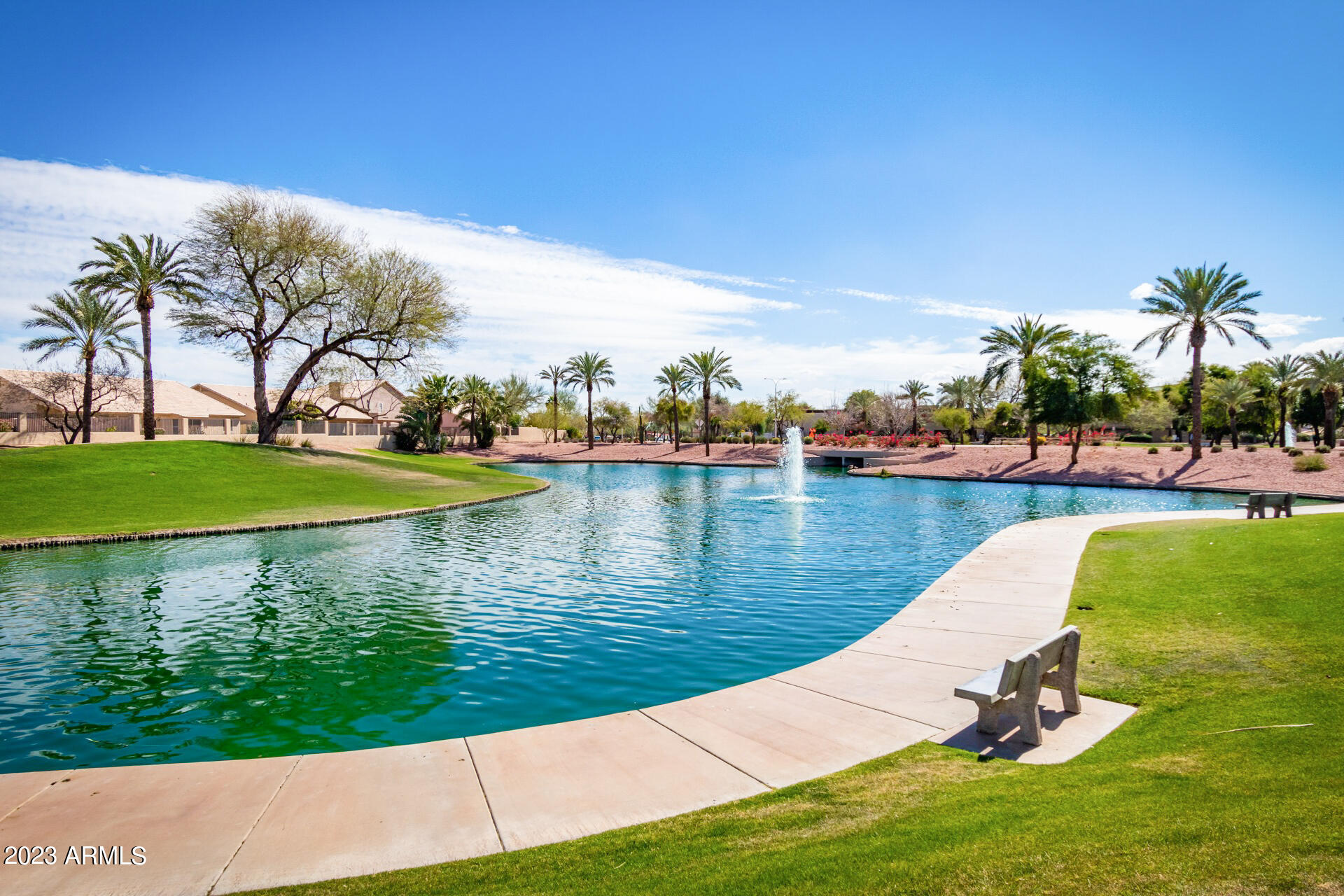 4266 East Agave Road Phoenix, AZ 85044 - Photo 49 of 54 a view of a lake with a yard