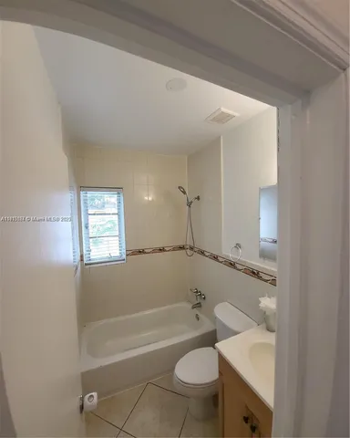 a bathroom with a sink toilet and bathtub