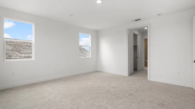 a bathroom with a tub and mirror