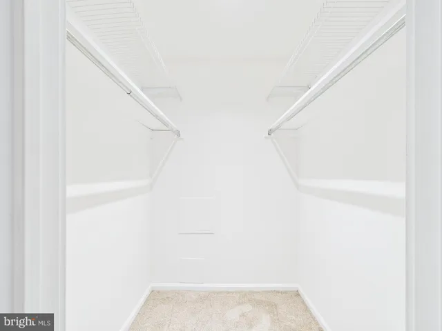 a view of staircase with white walls