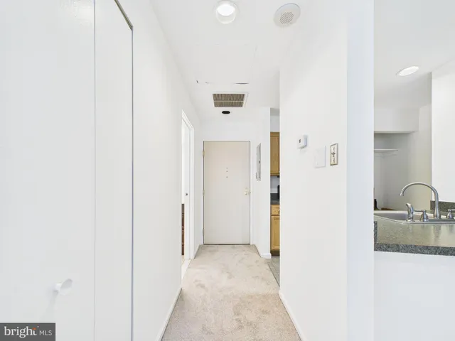 a view of a bathroom from the hallway