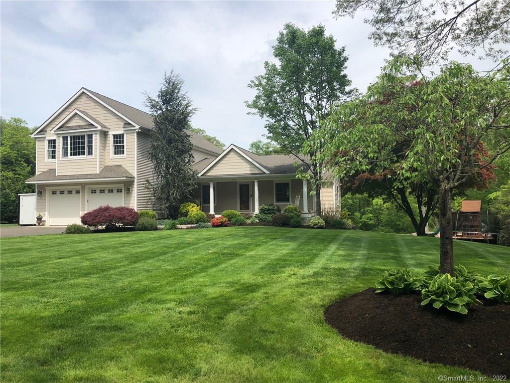 973 Garden Road Orange, CT 06477 - Photo 1 of 1 a front view of a house with a garden