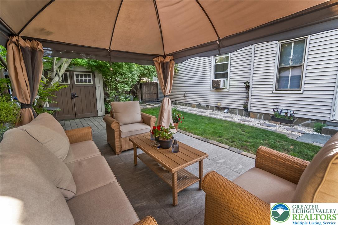 365 Rock Street Easton, PA 18042 - Photo 38 of 50 An inviting outdoor patio, perfect for relaxing, extends from the residence, featuring a cozy seating area.