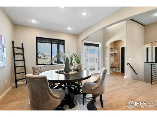 a dining room with furniture and window