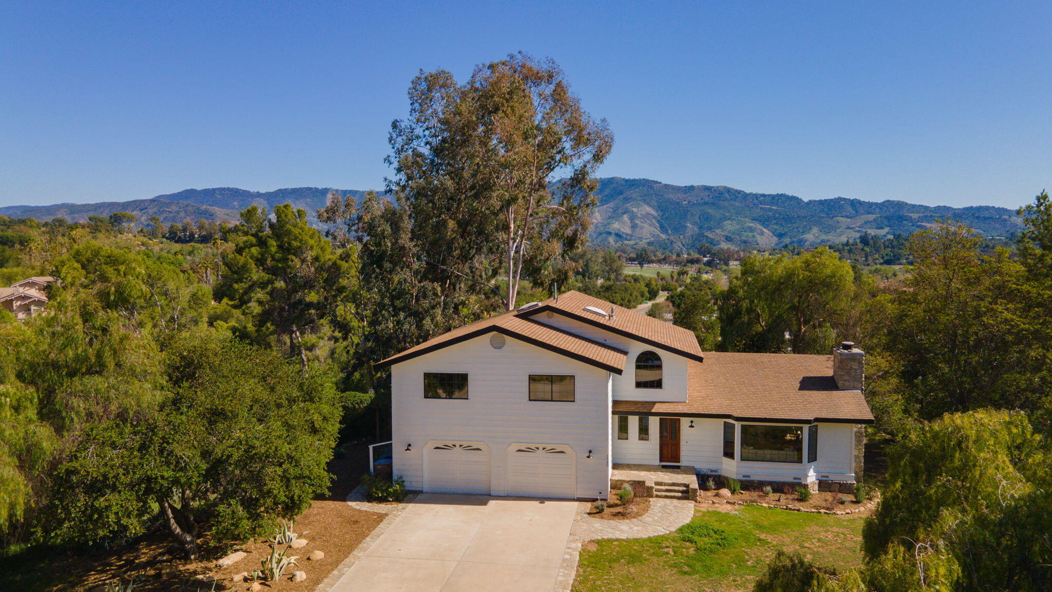 a house view with a garden space