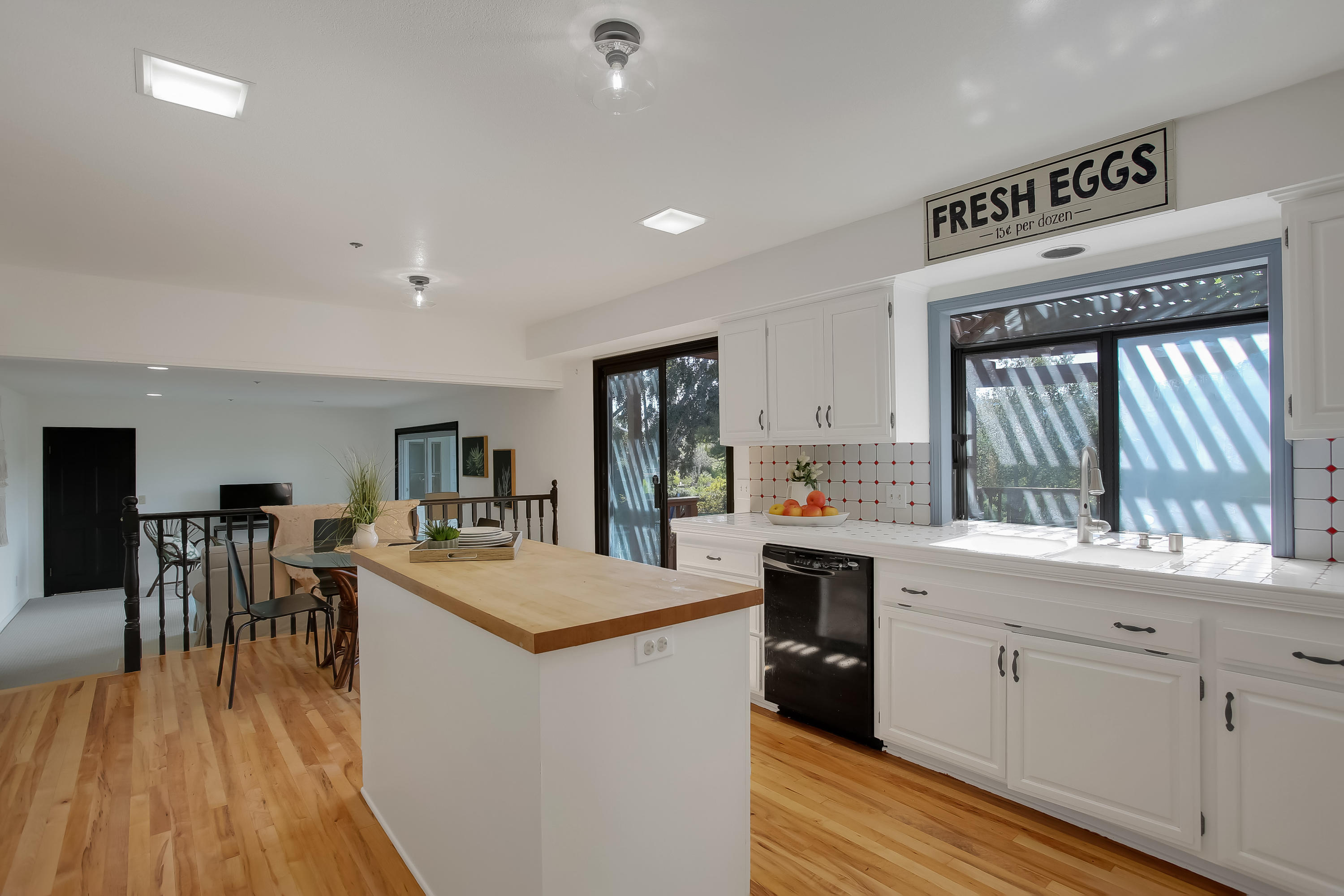 2080 Maricopa Highway Ojai, CA 93023 - Photo 14 of 47 a kitchen with a sink a stove cabinets and wooden floor