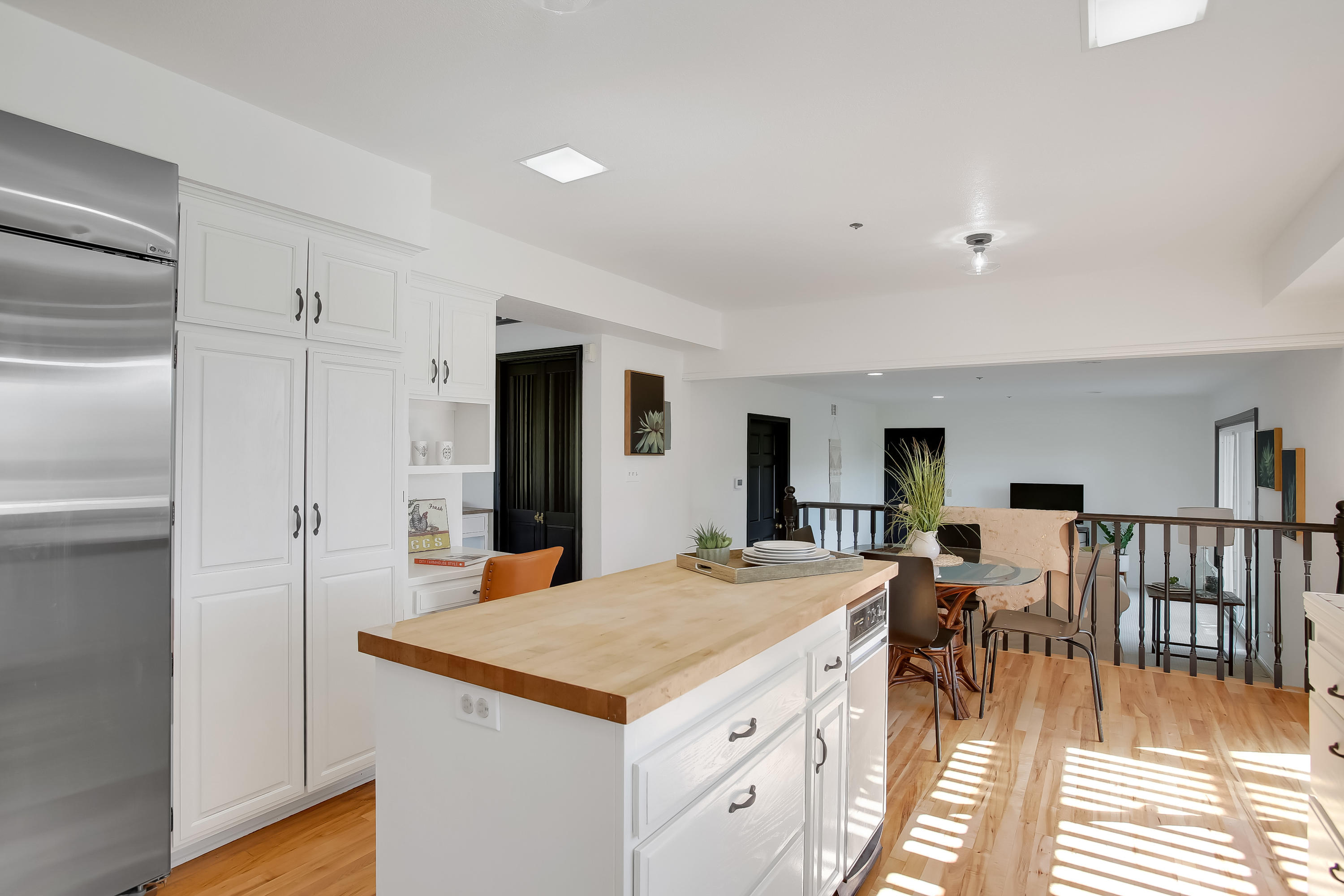 2080 Maricopa Highway Ojai, CA 93023 - Photo 15 of 47 a view of kitchen island wooden floor center island and stainless steel appliances
