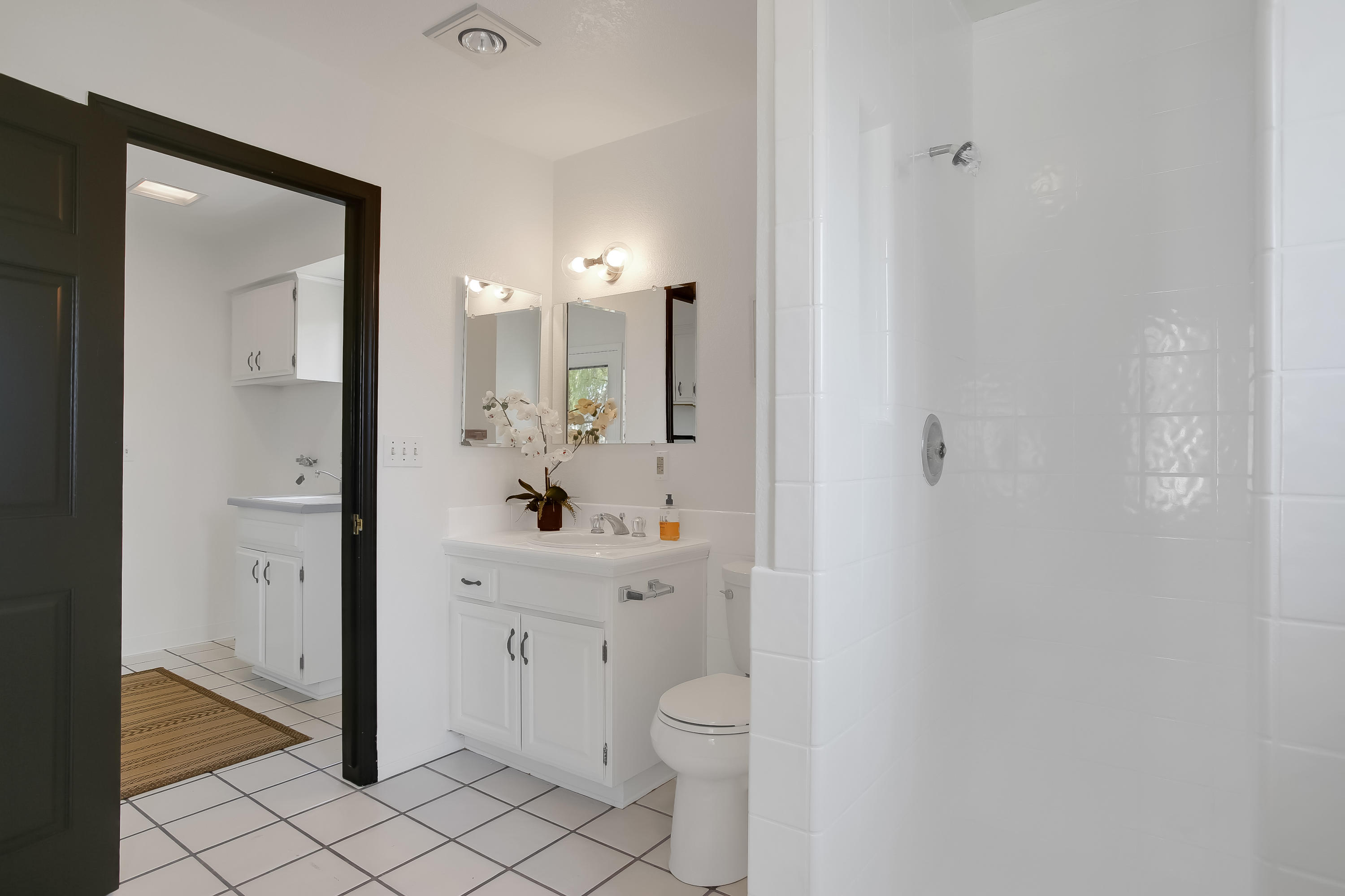 2080 Maricopa Highway Ojai, CA 93023 - Photo 24 of 47 a spacious bathroom with a toilet a sink a mirror and vanity