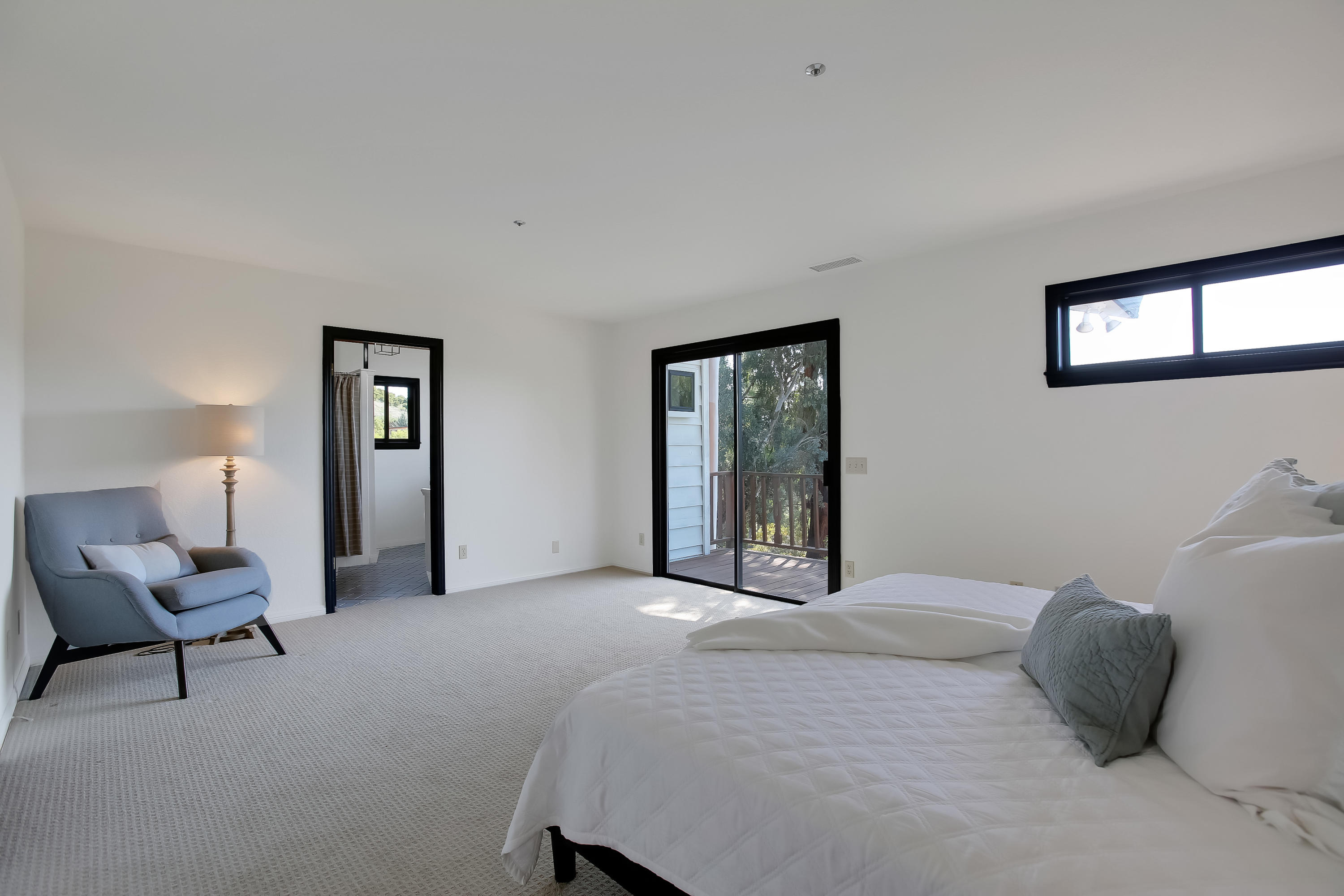 2080 Maricopa Highway Ojai, CA 93023 - Photo 28 of 47 a bedroom with a bed and a large mirror