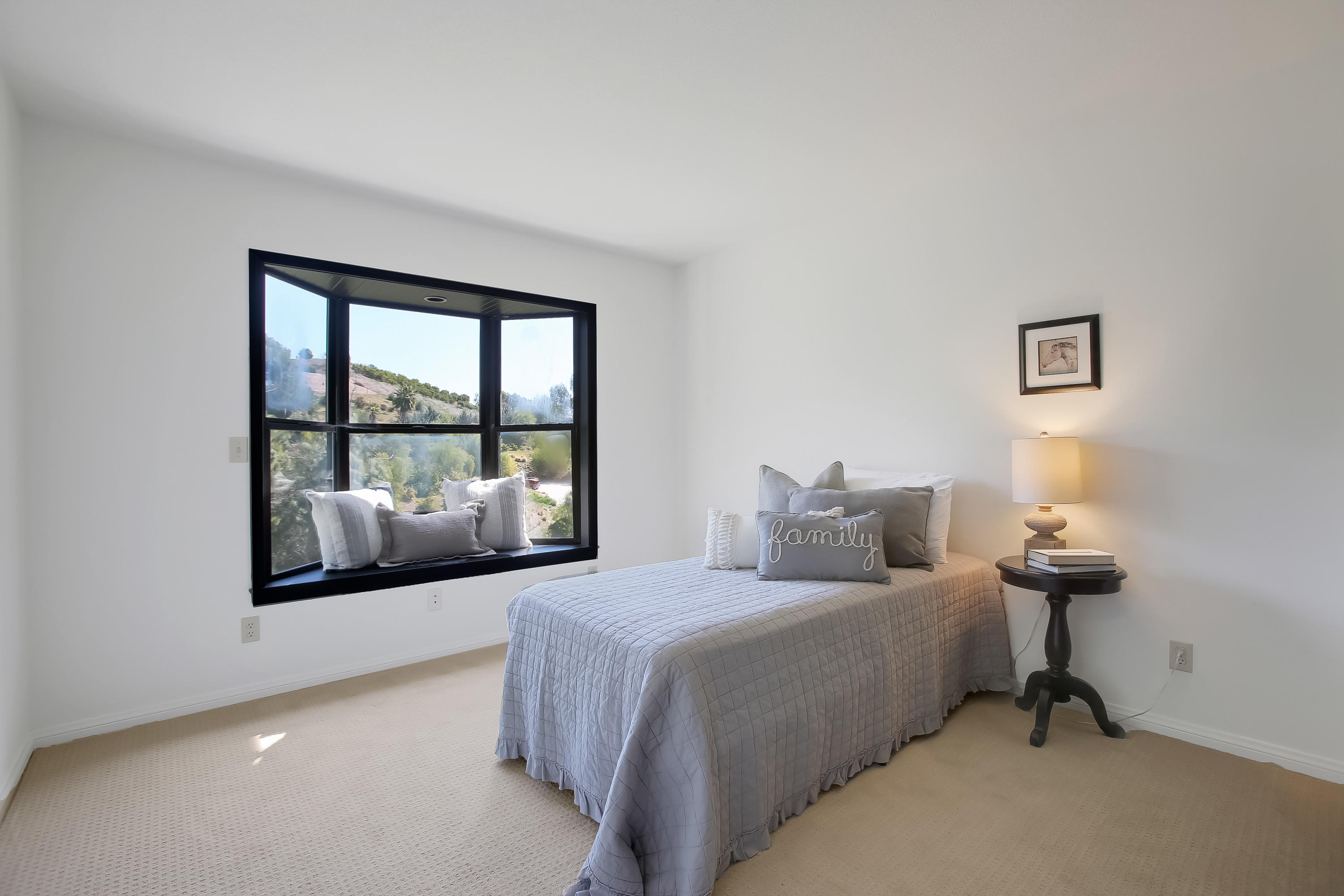 2080 Maricopa Highway Ojai, CA 93023 - Photo 33 of 47 a bedroom with a bed and a large window