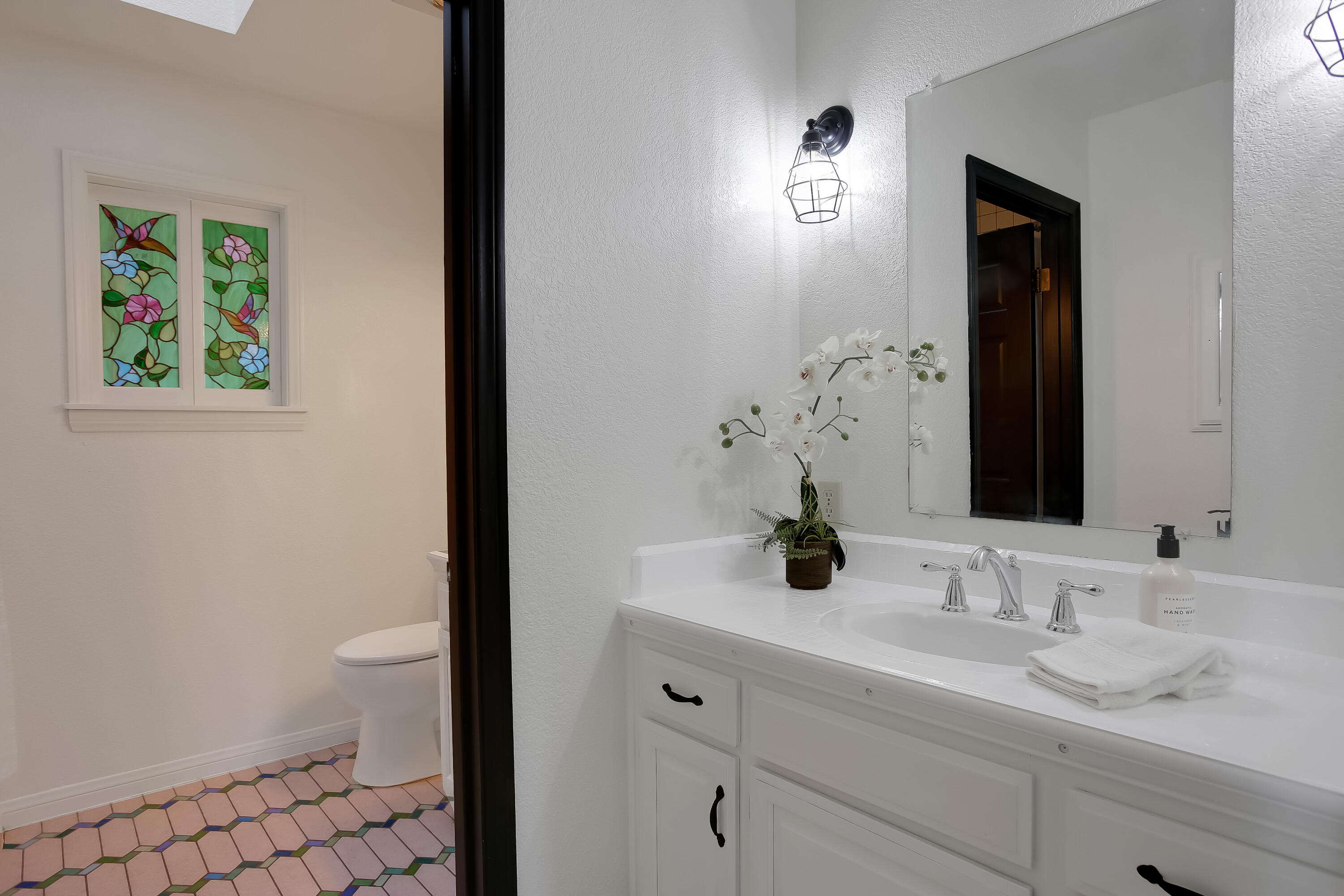 2080 Maricopa Highway Ojai, CA 93023 - Photo 34 of 47 a bathroom with a sink a toilet and mirror
