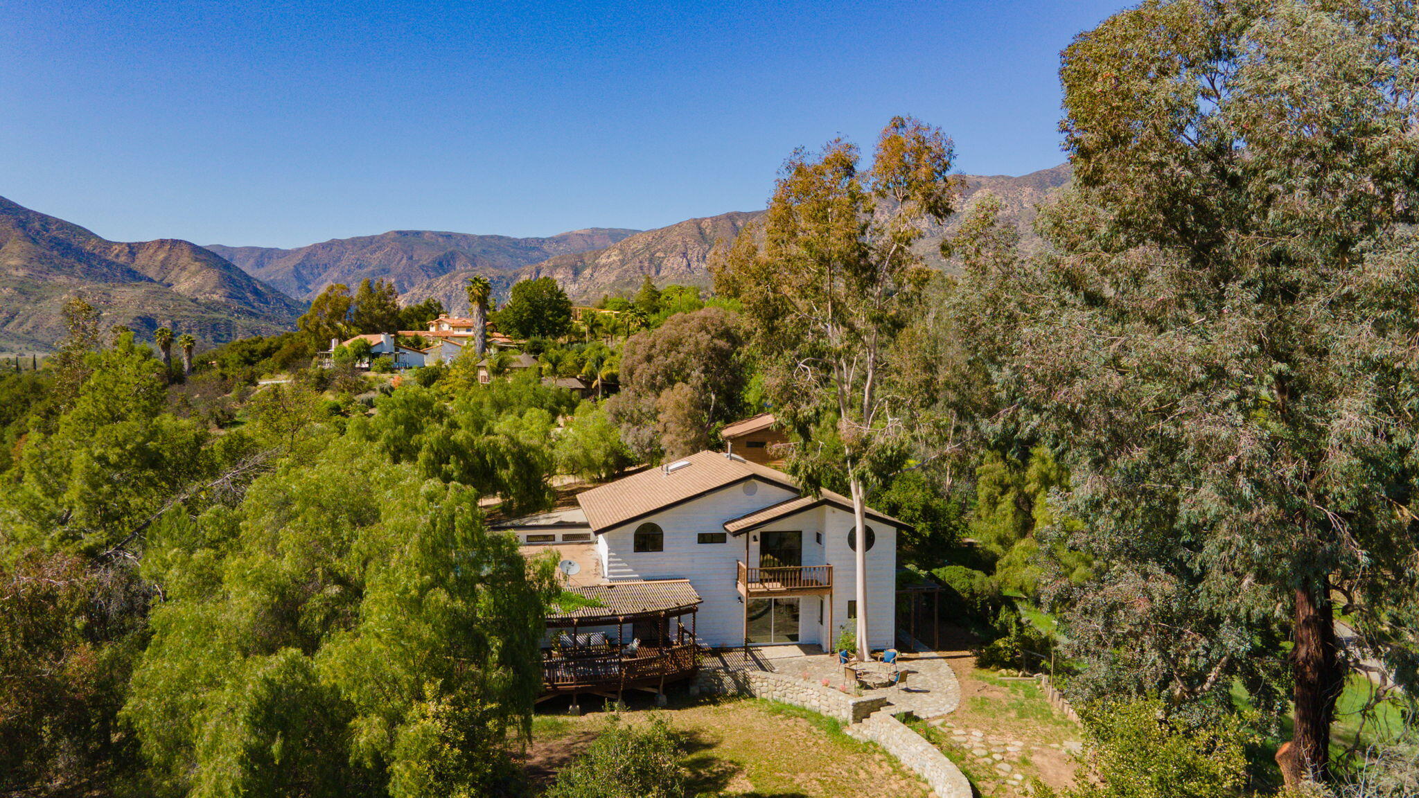2080 Maricopa Highway Ojai, CA 93023 - Photo 44 of 47 a front view of a house with a yard and mountain
