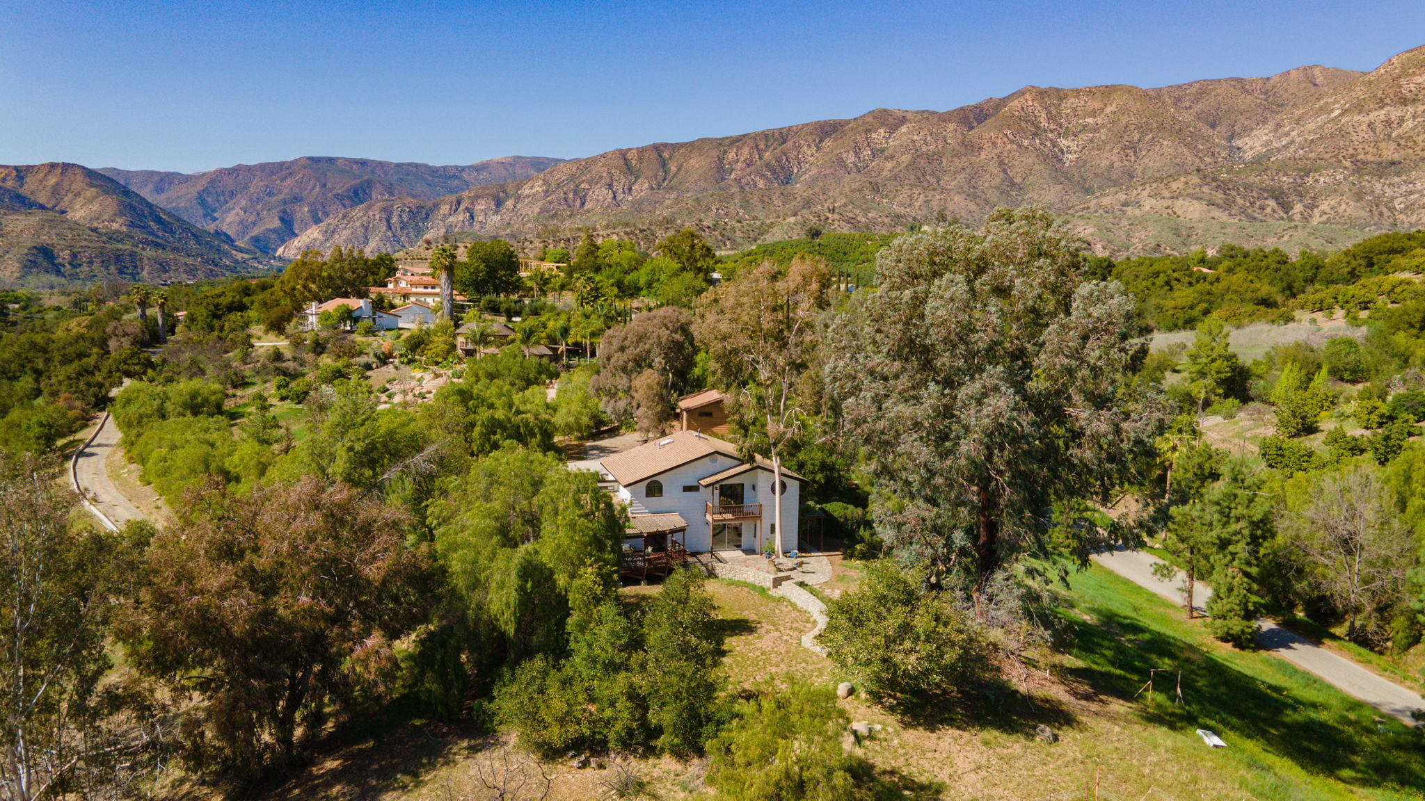 2080 Maricopa Highway Ojai, CA 93023 - Photo 8 of 47 a view of a house with a mountain and a forest