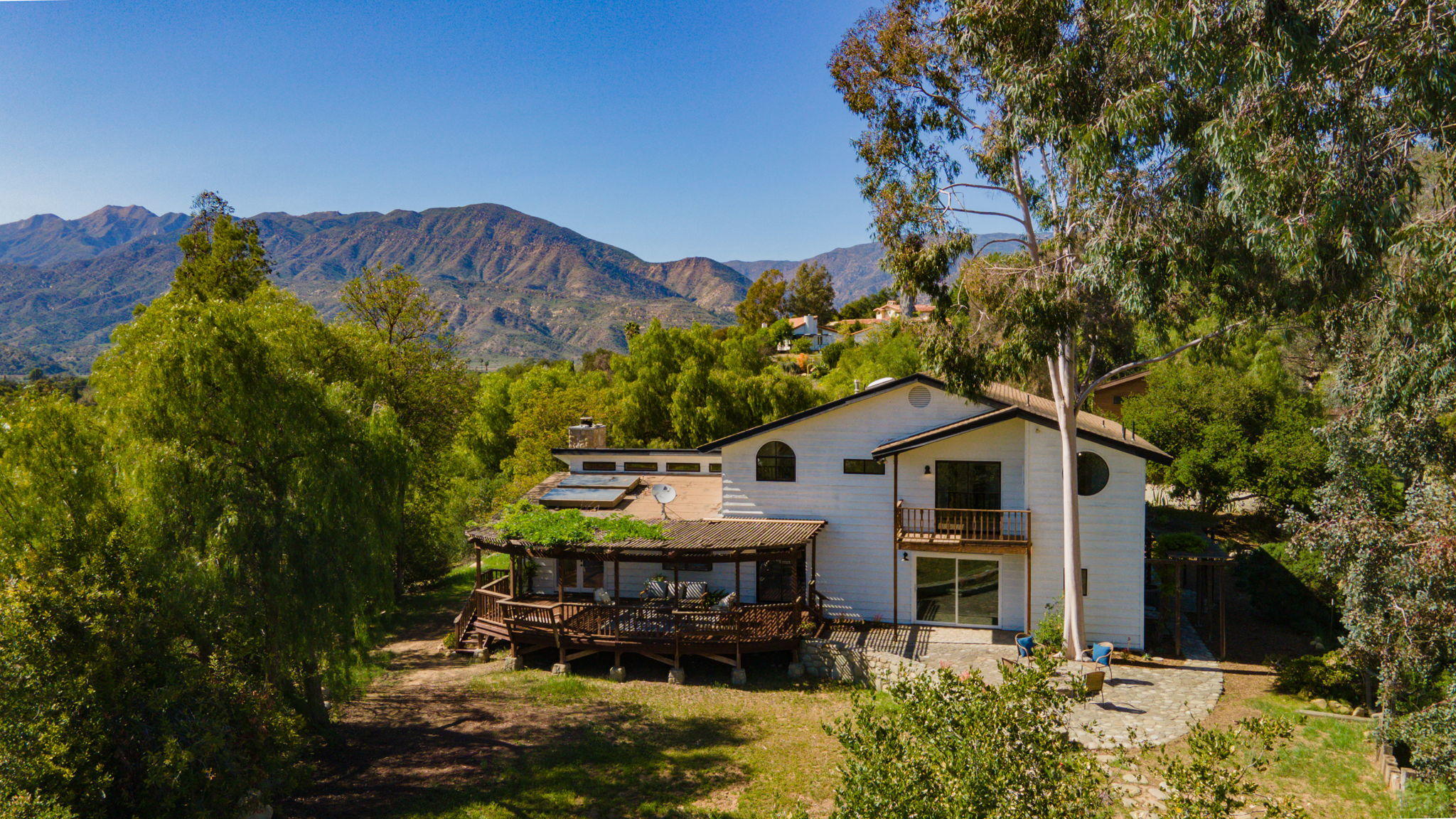 2080 Maricopa Highway Ojai, CA 93023 - Photo 9 of 47 a view of a house with roof yard and outdoor seating