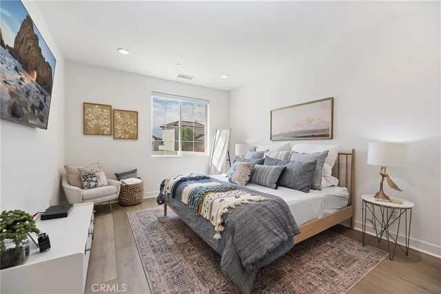 a bedroom with bed and a couch