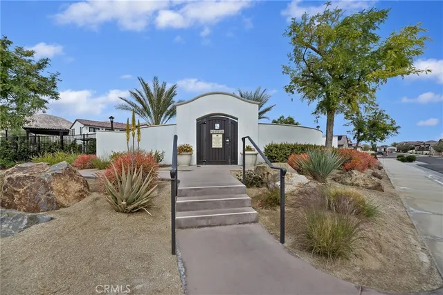 a view of a porch with dining table and chairs
