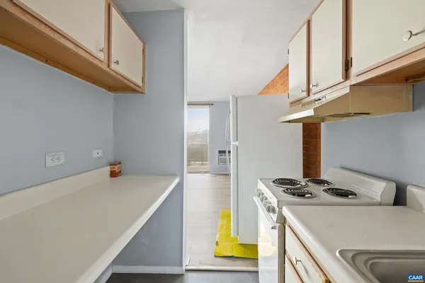 a kitchen with a stove and a microwave