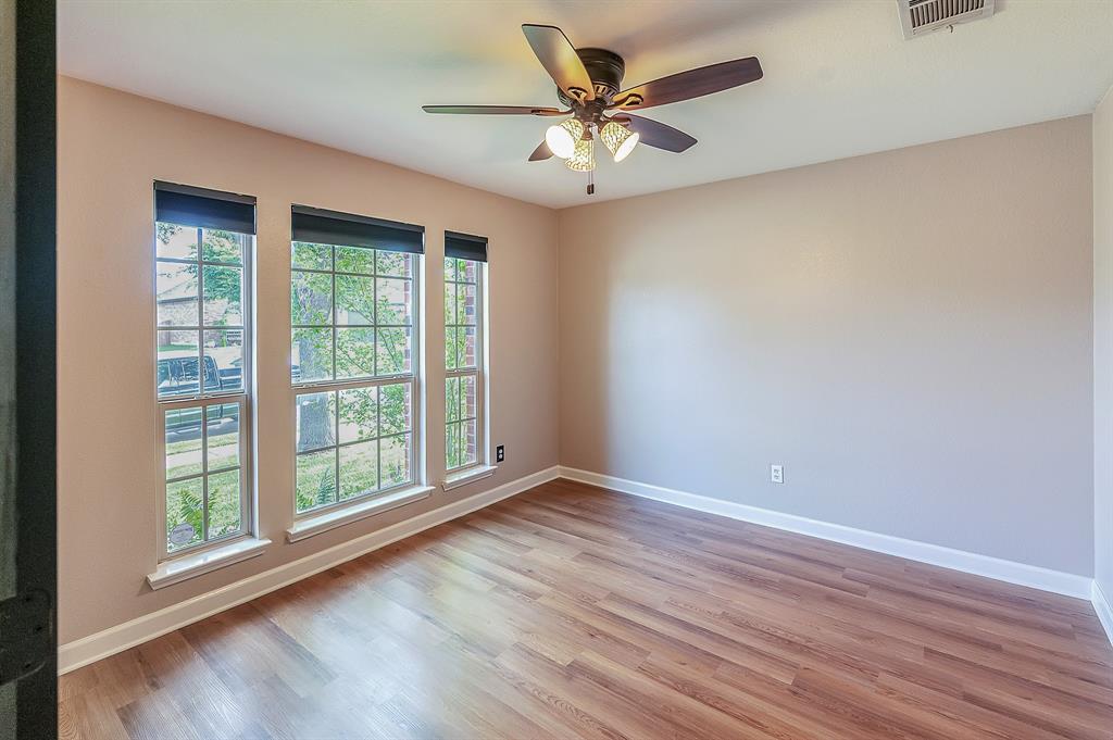 1070 Shepard Lane Lavon, TX 75166 - Photo 5 of 29 a view of an empty room with window and wooden floor