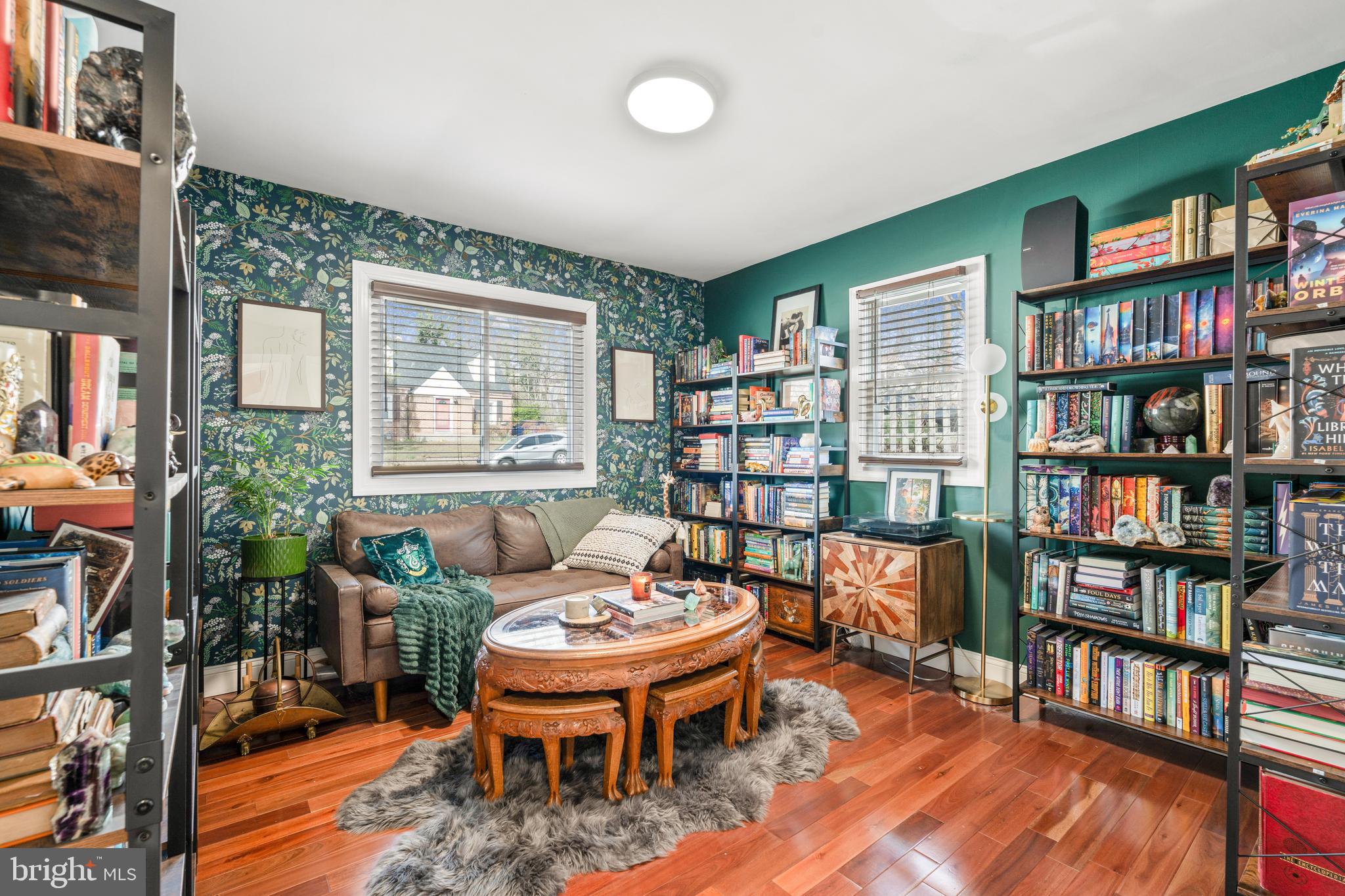 7745 Garrison Road Hyattsville, MD 20784 - Photo 16 of 43 a living room with furniture and a book shelf
