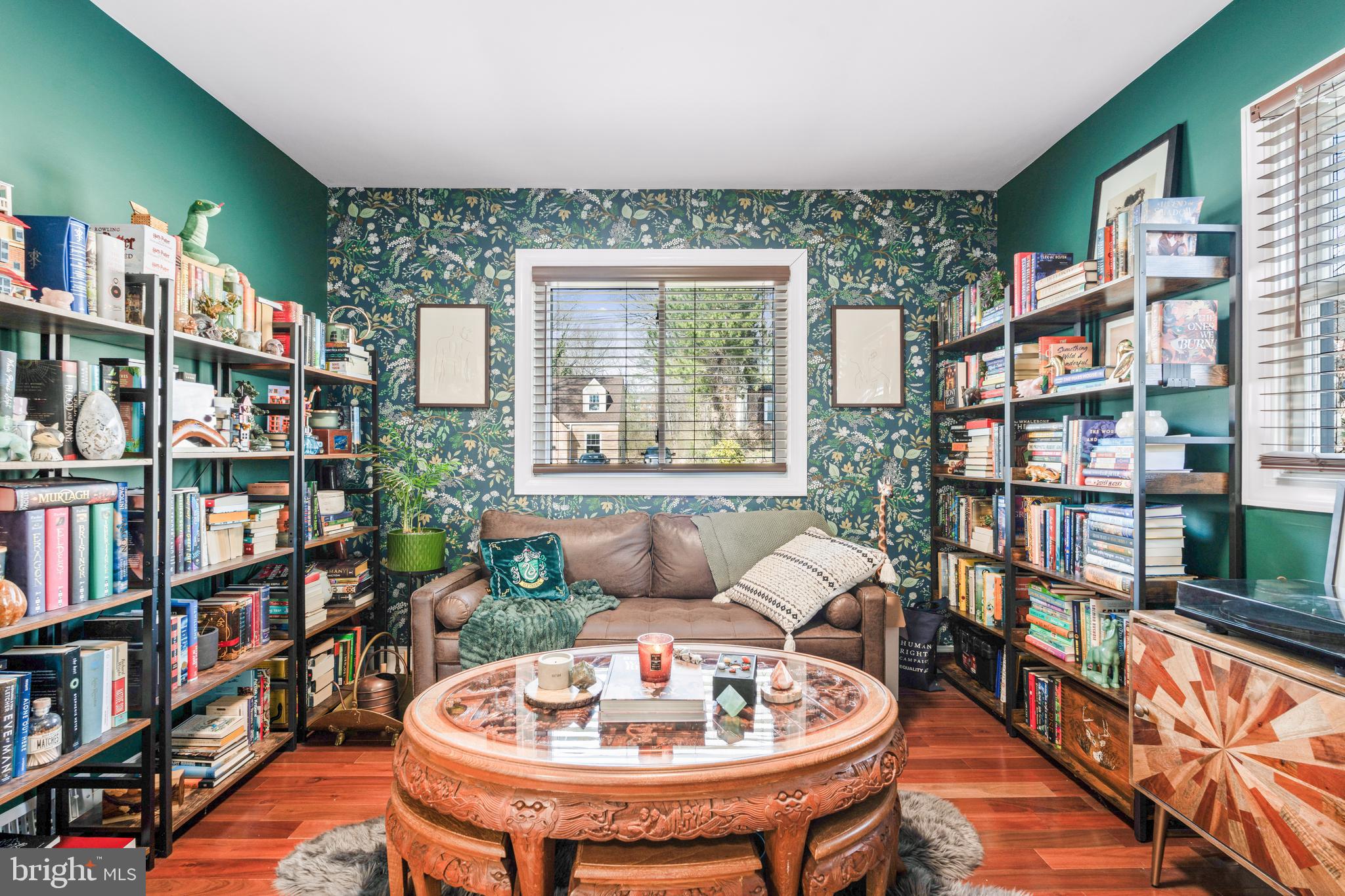 7745 Garrison Road Hyattsville, MD 20784 - Photo 17 of 43 a living room with furniture and a book shelf