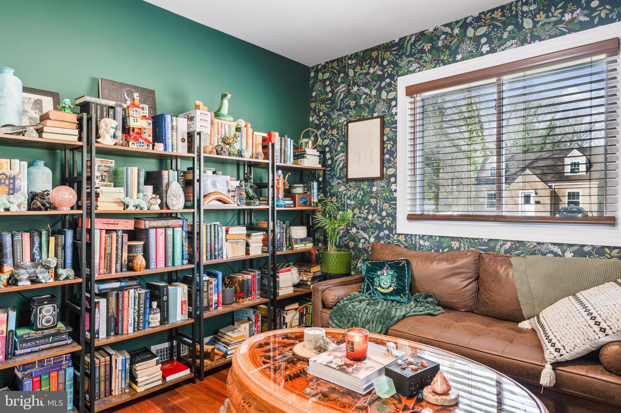 7745 Garrison Road Hyattsville, MD 20784 - Photo 18 of 43 a living room with furniture and a book shelf