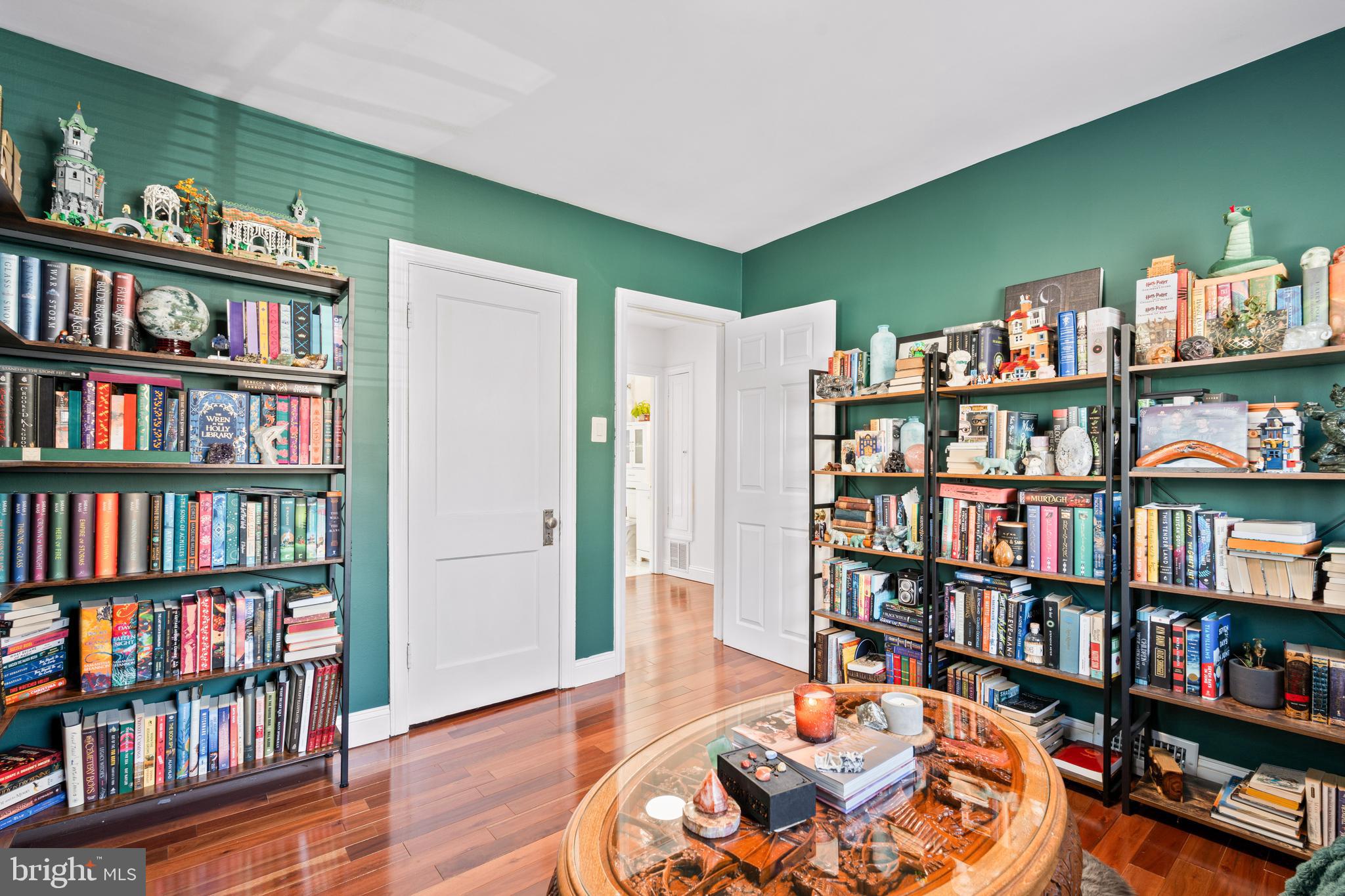7745 Garrison Road Hyattsville, MD 20784 - Photo 19 of 43 a living room with a book shelf and a book shelf