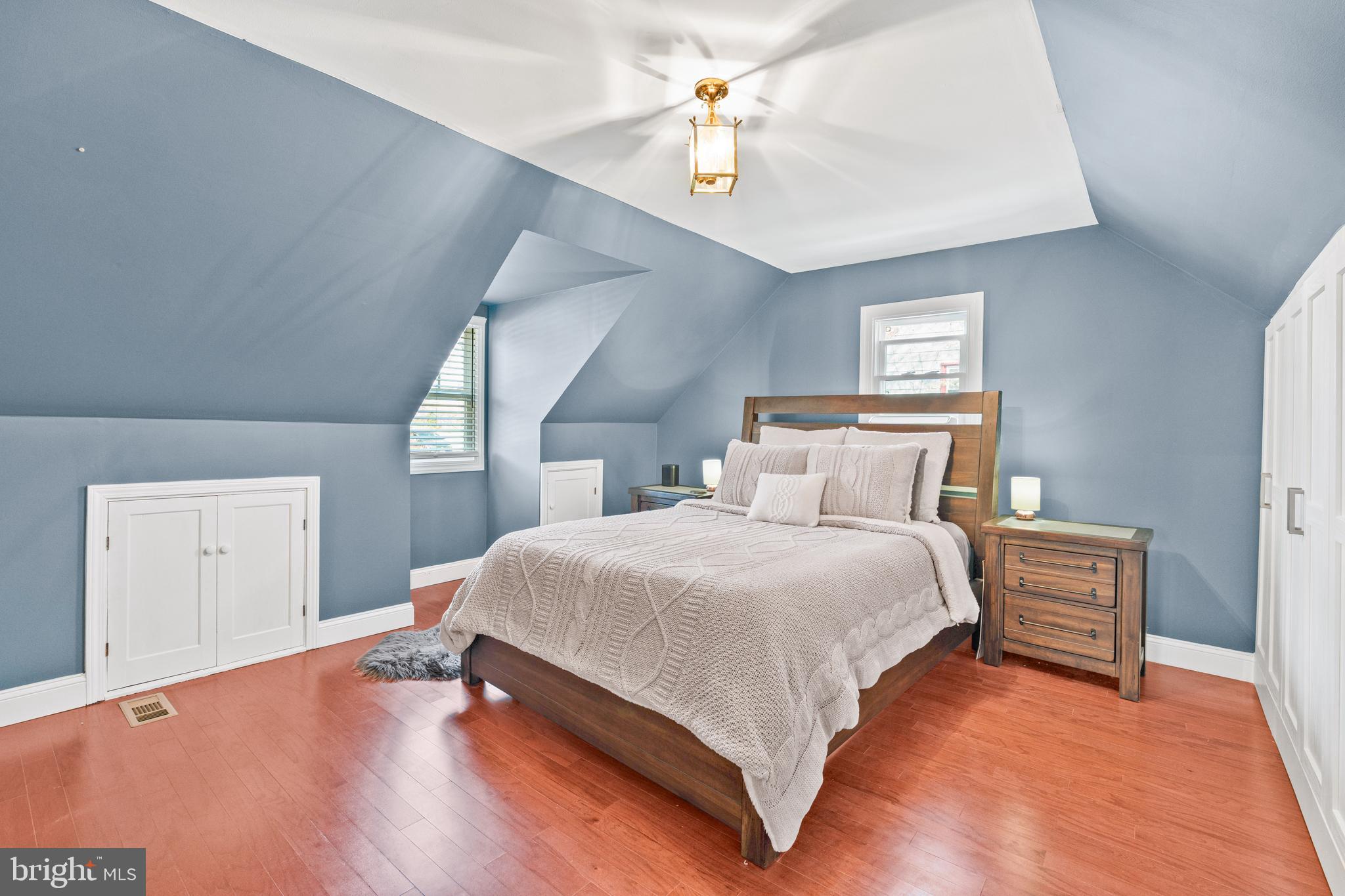 7745 Garrison Road Hyattsville, MD 20784 - Photo 22 of 43 a bedroom with a bed and a chandelier