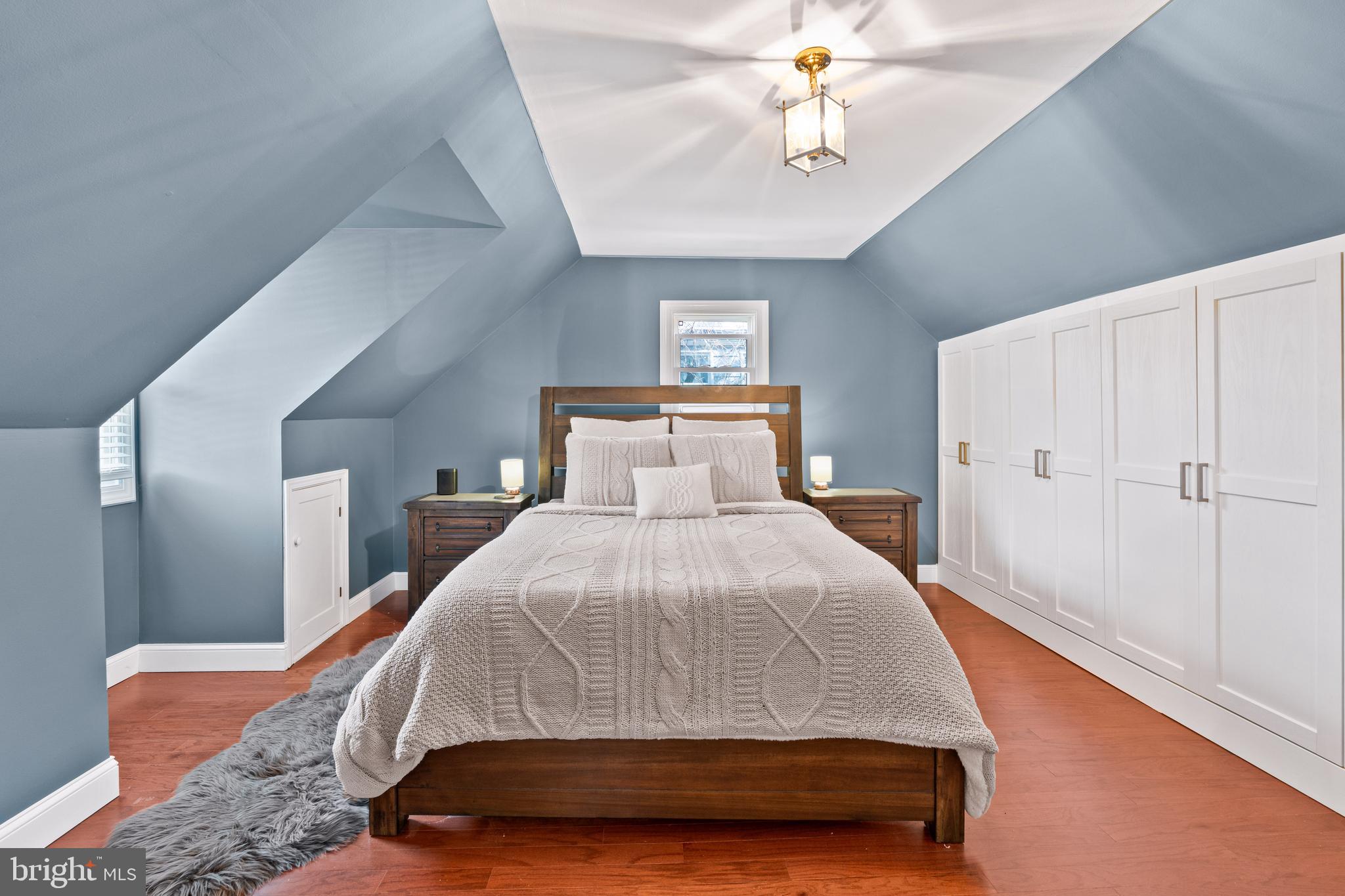 7745 Garrison Road Hyattsville, MD 20784 - Photo 23 of 43 a bedroom with a bed and a chandelier