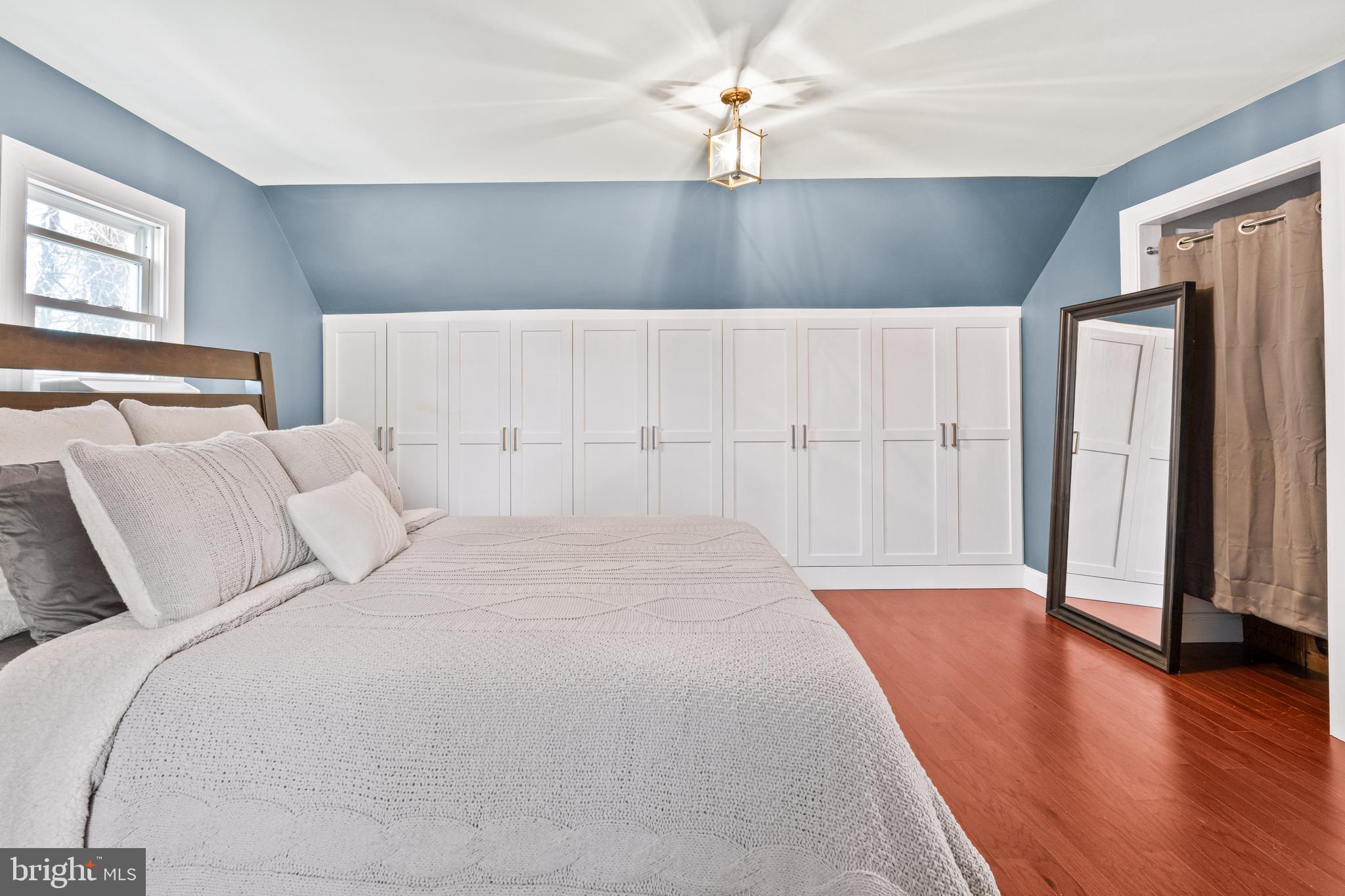 7745 Garrison Road Hyattsville, MD 20784 - Photo 25 of 43 a large bed sitting in a bedroom next to a window