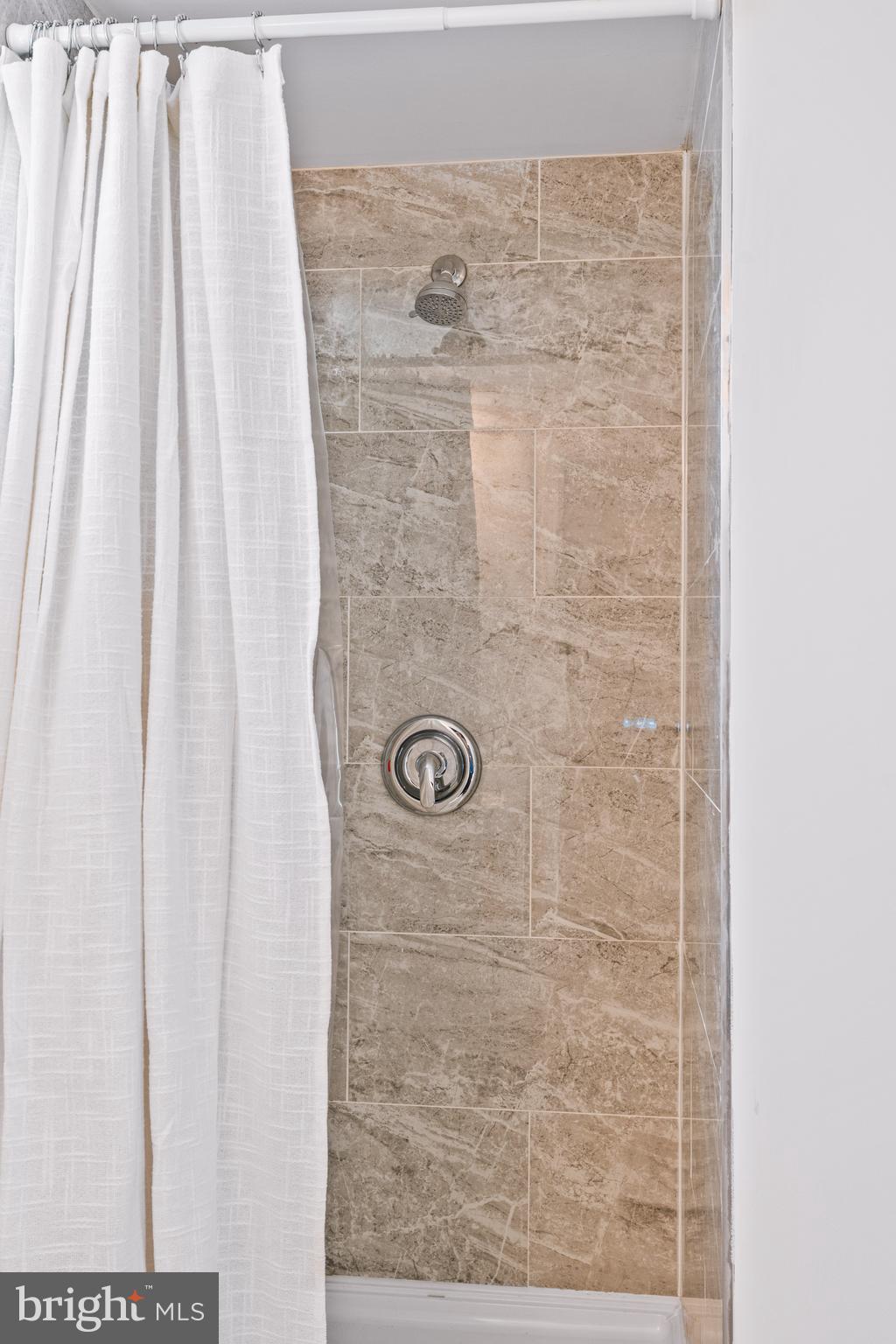 7745 Garrison Road Hyattsville, MD 20784 - Photo 28 of 43 a bathroom with a shower