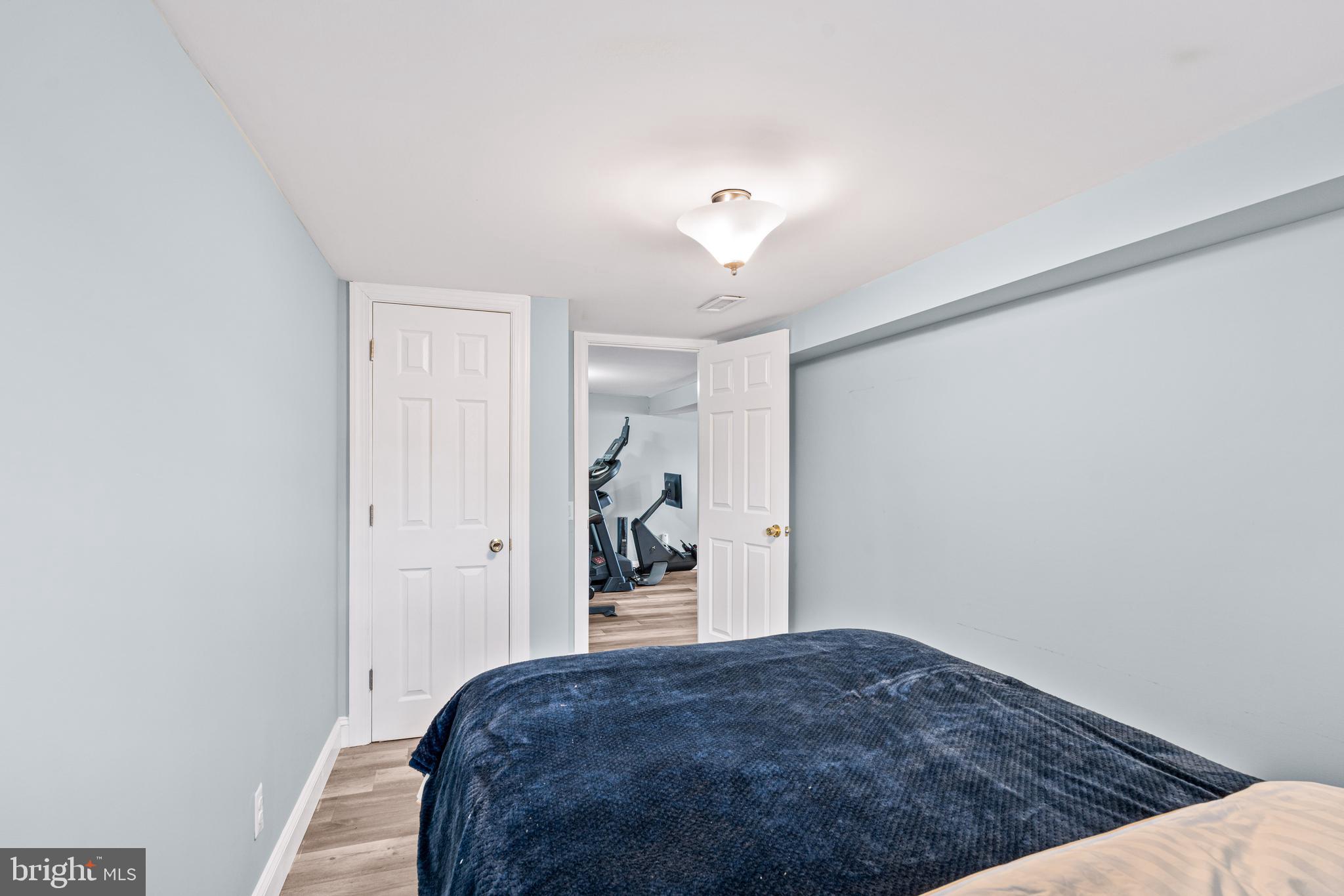 7745 Garrison Road Hyattsville, MD 20784 - Photo 30 of 43 a bedroom with a bed and closet