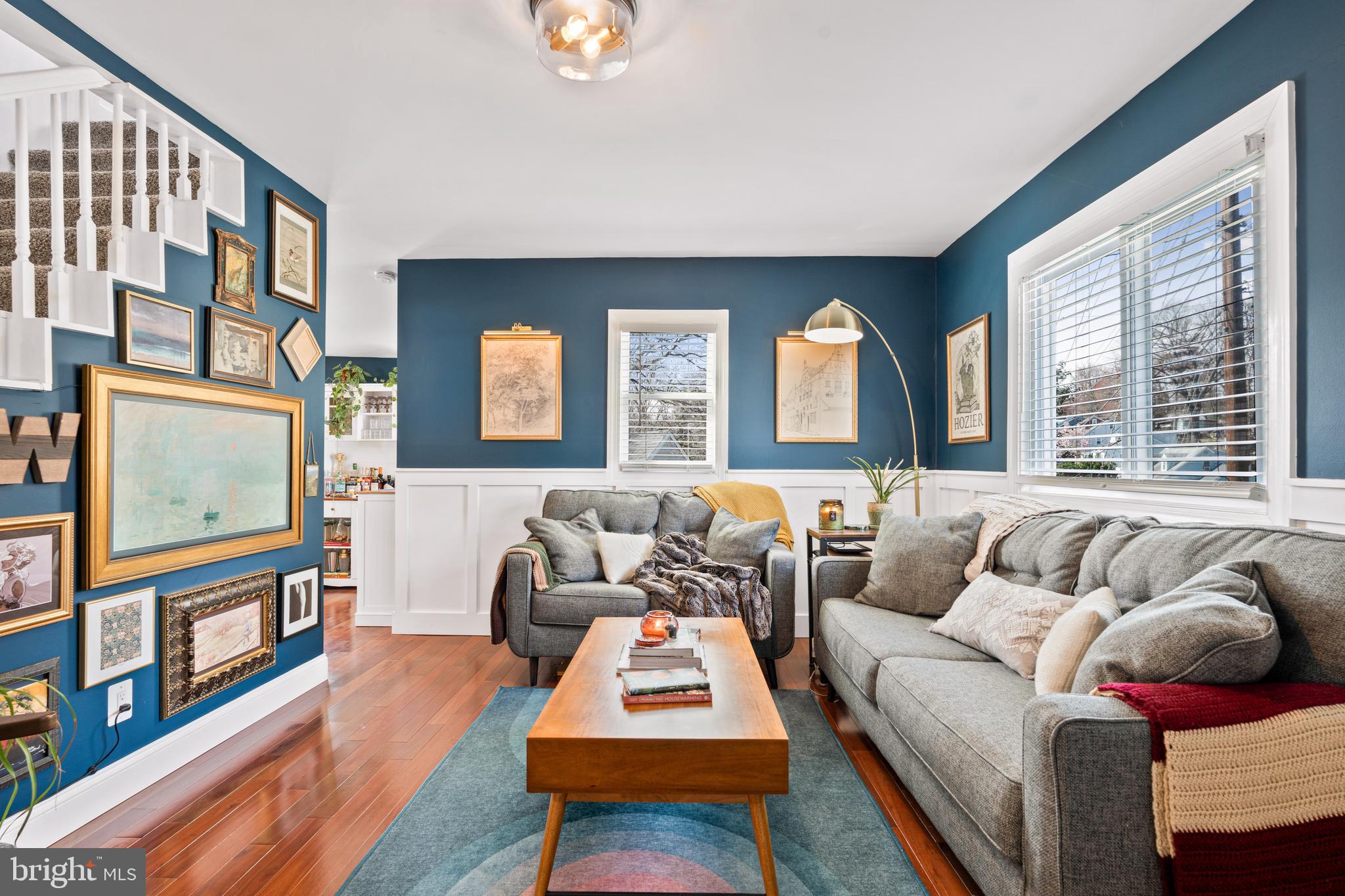 7745 Garrison Road Hyattsville, MD 20784 - Photo 4 of 43 a living room with furniture and a flat screen tv