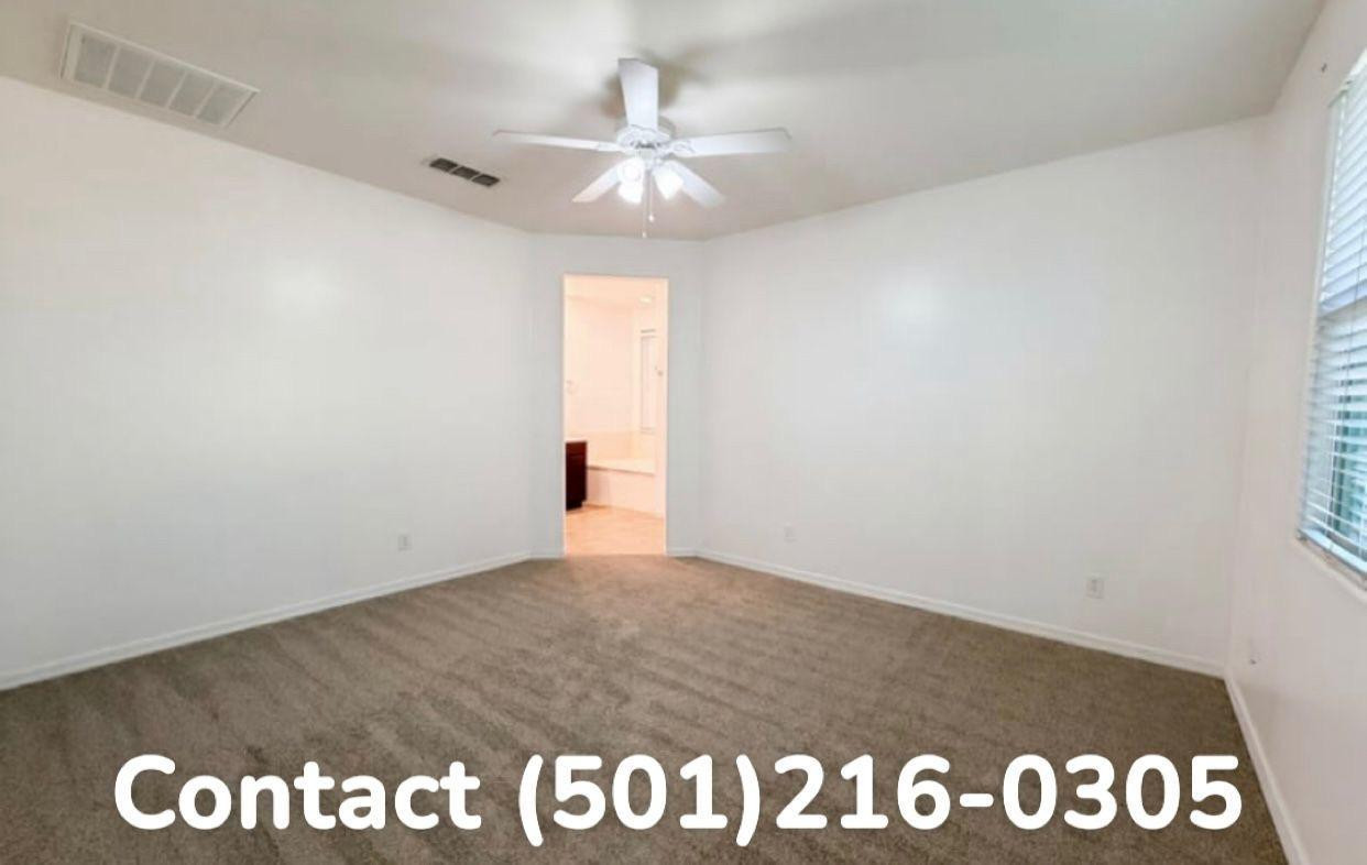 602 West Beautiful Lane Phoenix, AZ 85041 - Photo 7 of 7 an empty room with a window