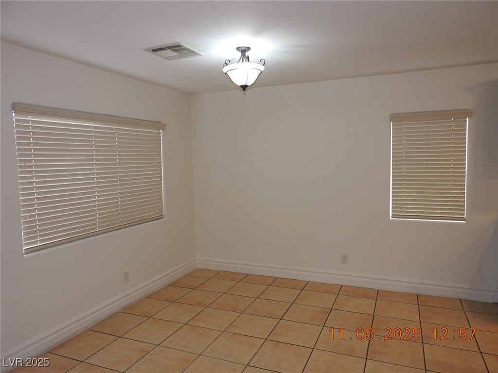 240 Rustic Club Way Las Vegas, NV 89148 - Photo 11 of 40 Spare room with light tile patterned floors