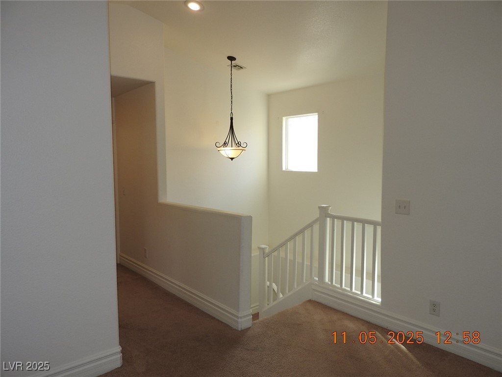 240 Rustic Club Way Las Vegas, NV 89148 - Photo 17 of 40 Corridor with an upstairs landing, dark carpet, and recessed lighting