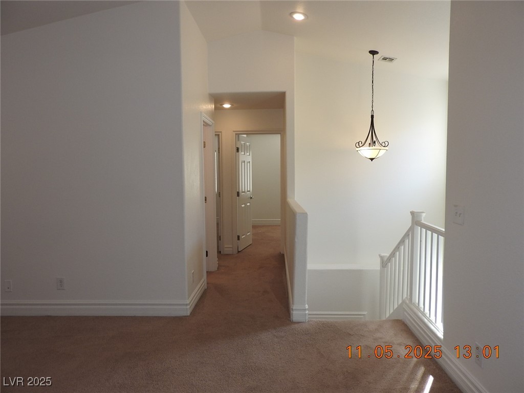 240 Rustic Club Way Las Vegas, NV 89148 - Photo 26 of 40 Hall with carpet, an upstairs landing, vaulted ceiling, and recessed lighting