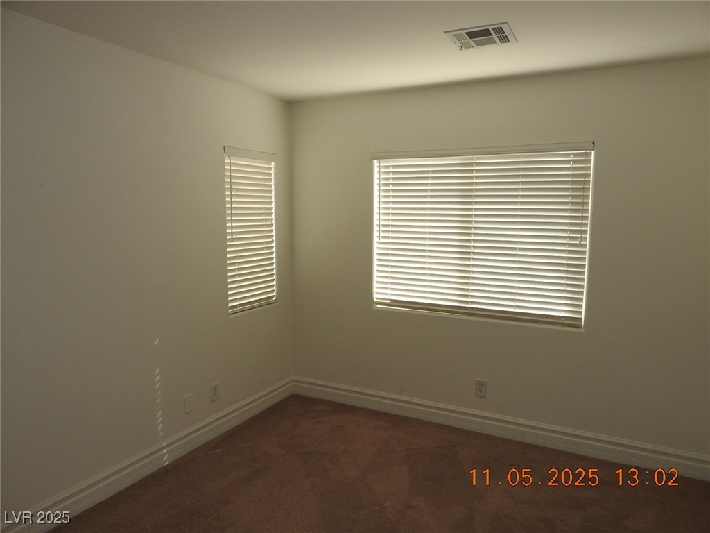 240 Rustic Club Way Las Vegas, NV 89148 - Photo 29 of 40 Unfurnished room with dark carpet and baseboards